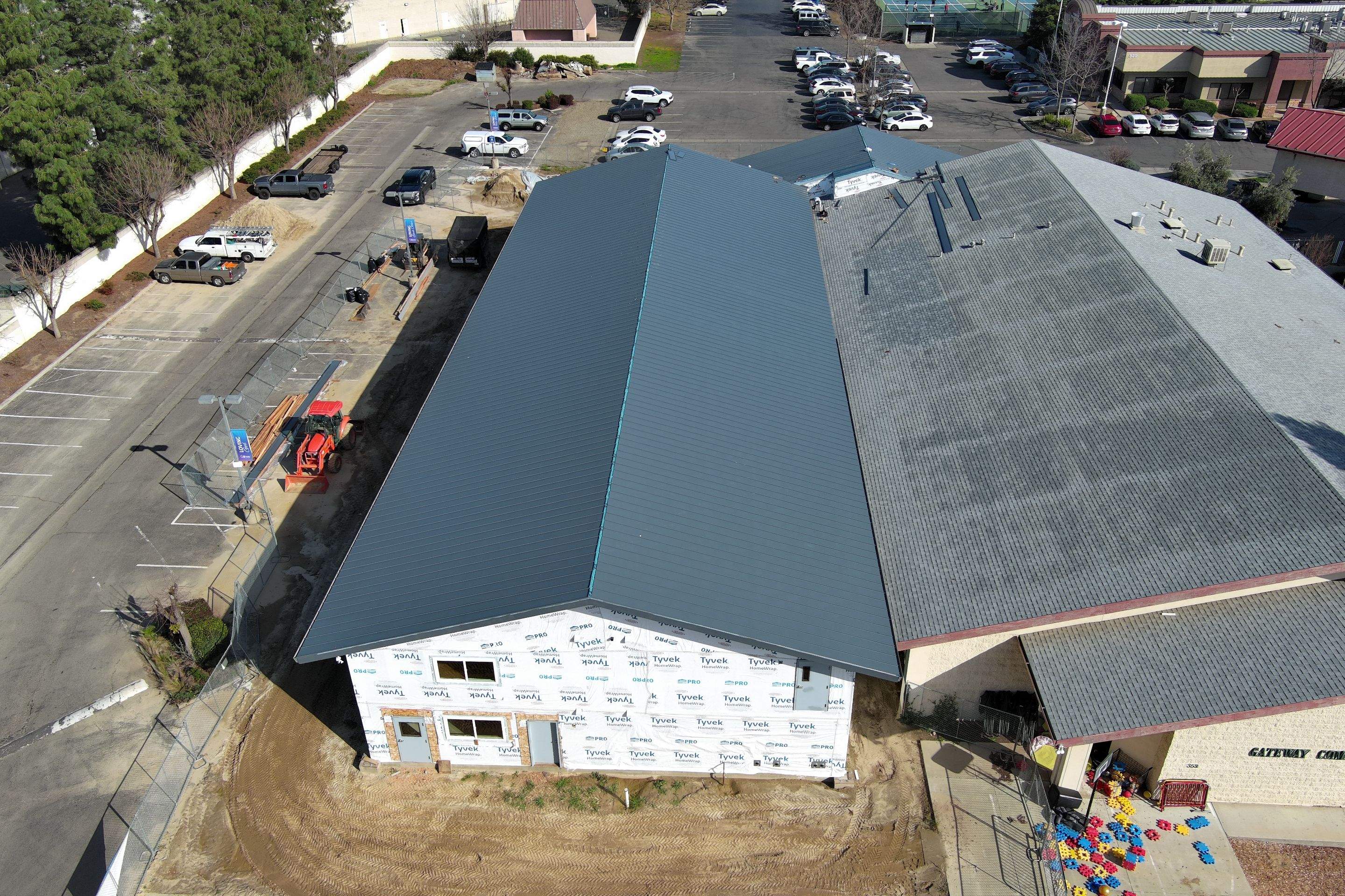 Metal roofing installation on church by Straight Edge Roofing Inc