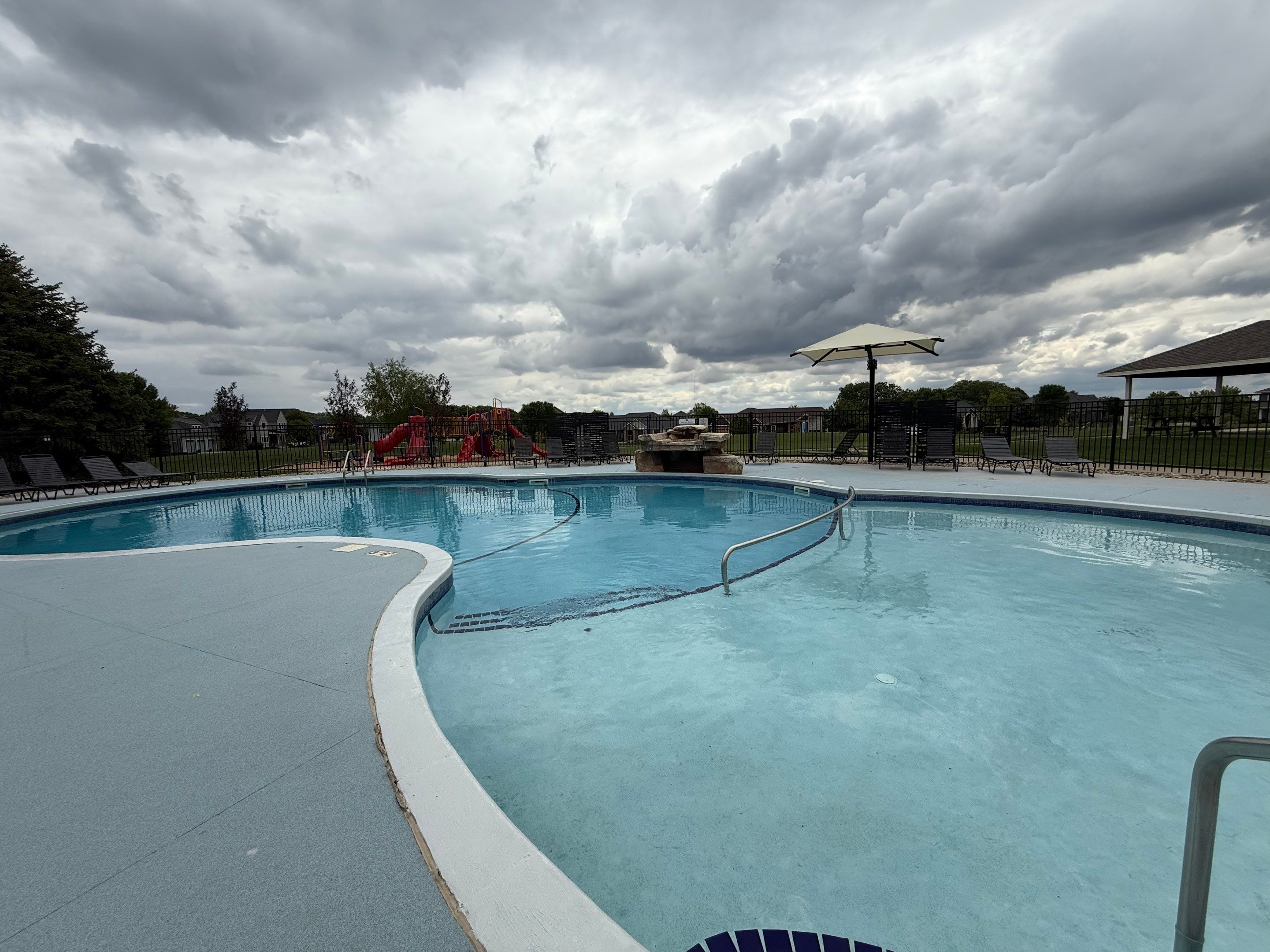Arbors Edge Pool Deck Restoration and Textured Concrete Coating by Select Painting, Coatings & Garage Cabinets