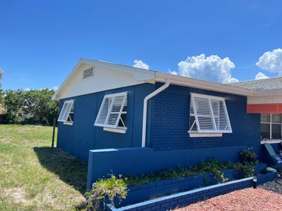 White & Coral Bahama Shutters