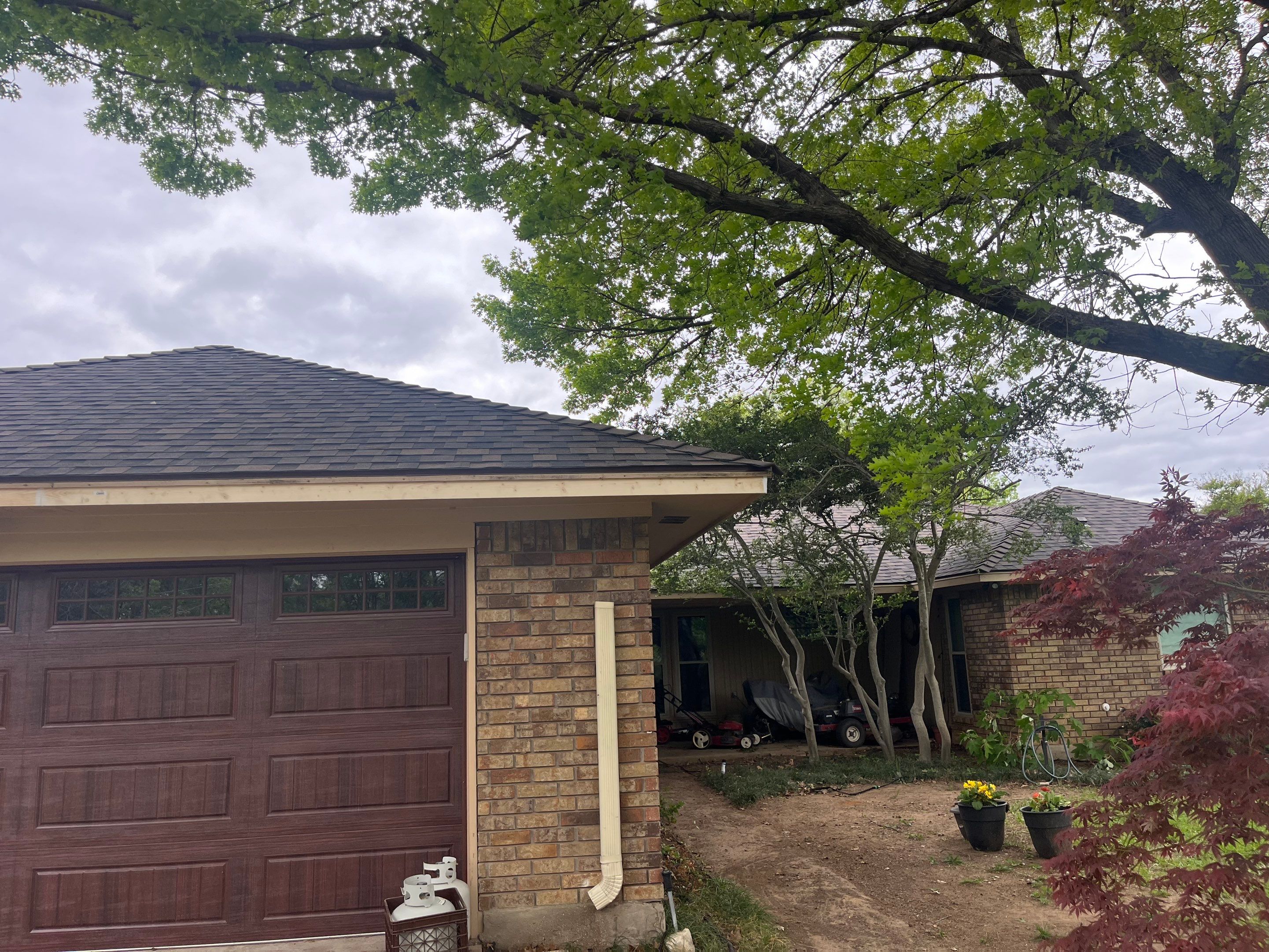 Brown brick with IKO Shadow Brown by Tejas Roofworks + Restoration