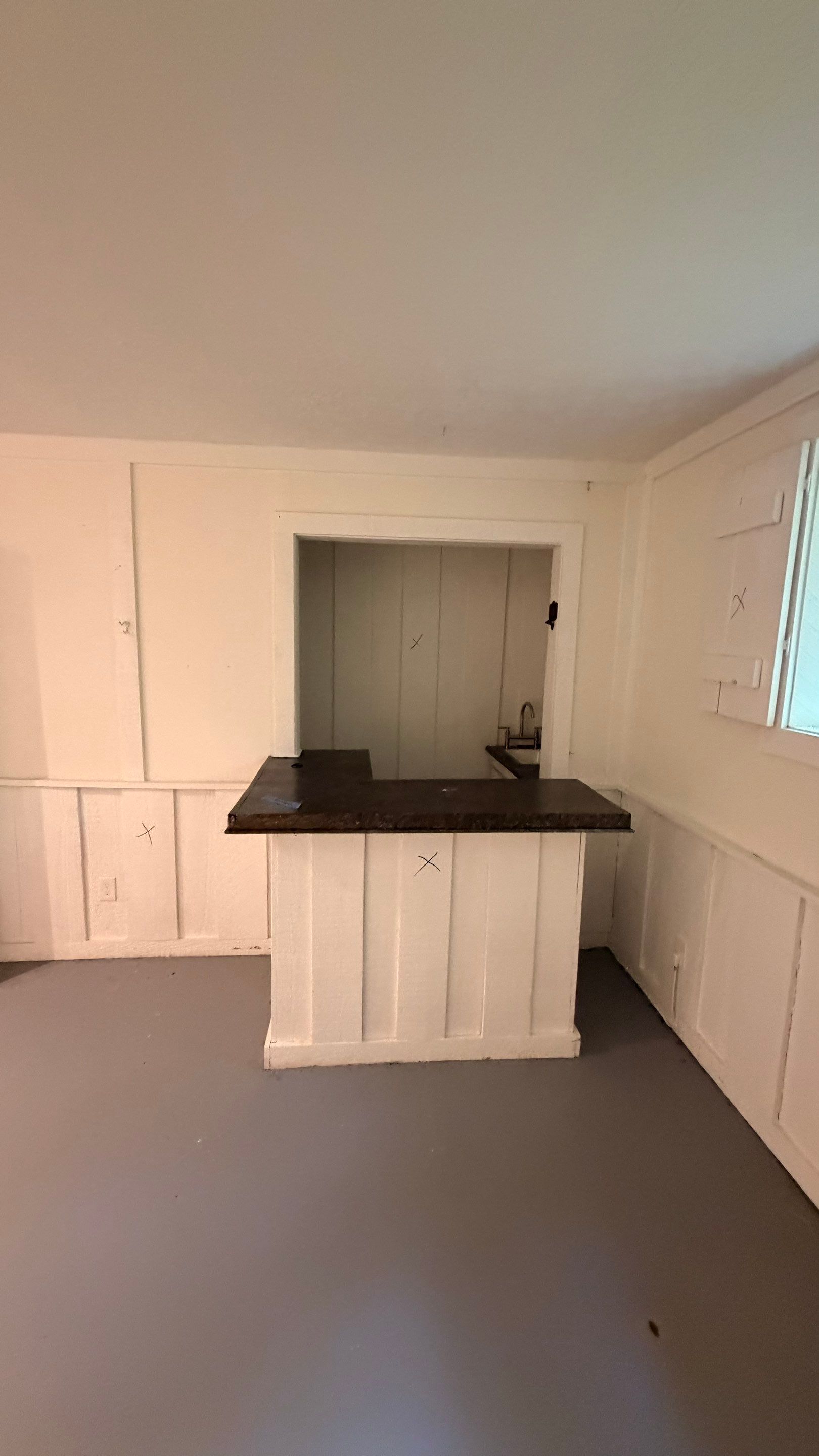 Basement Remodeling with Wood-Look Flooring and Custom Wainscoting in Dunwoody by Swift Home Renovations