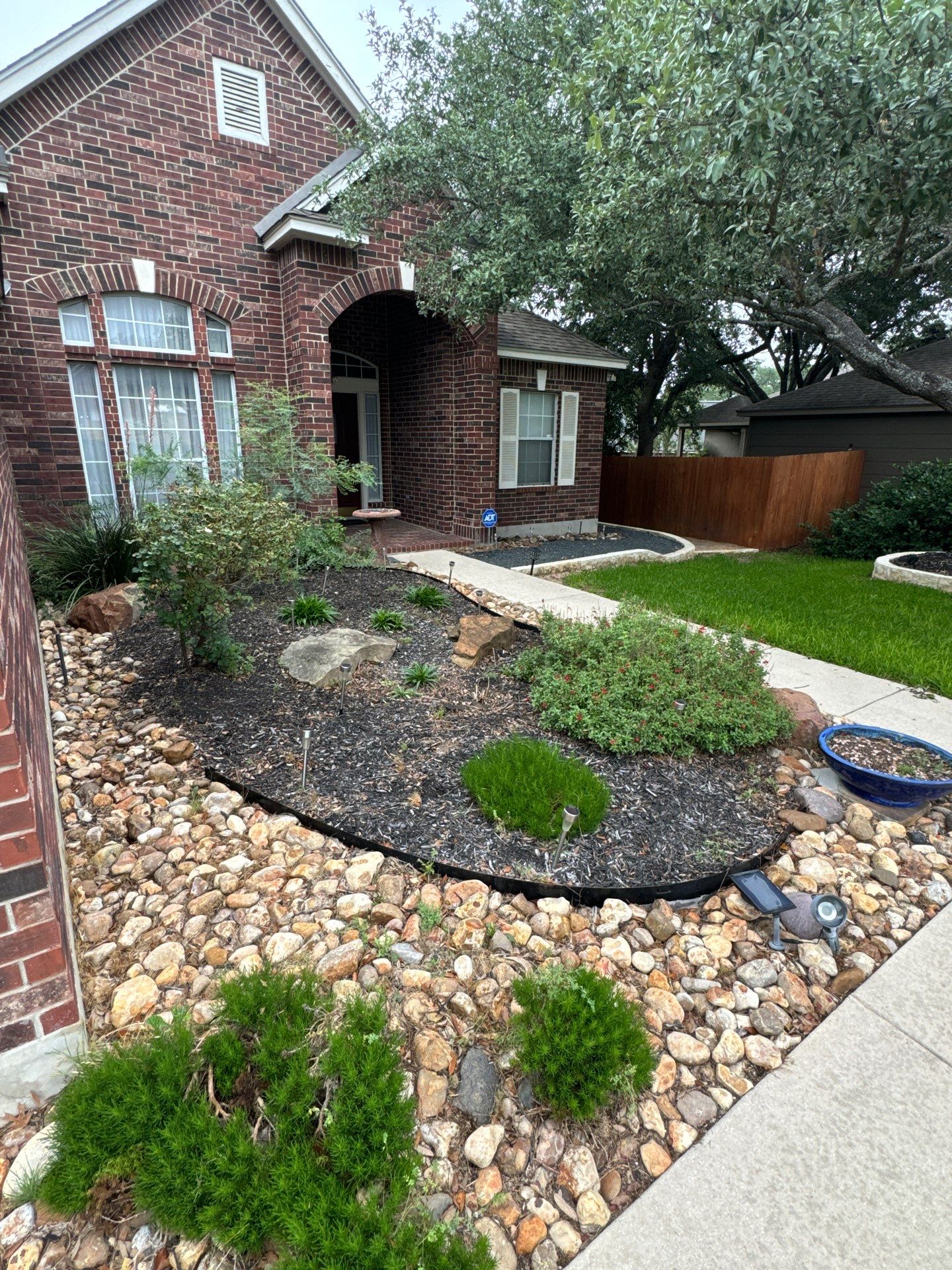 Landscaping Enhancement  using Texas Black Gravel by Hole In One Lawns, LLC
