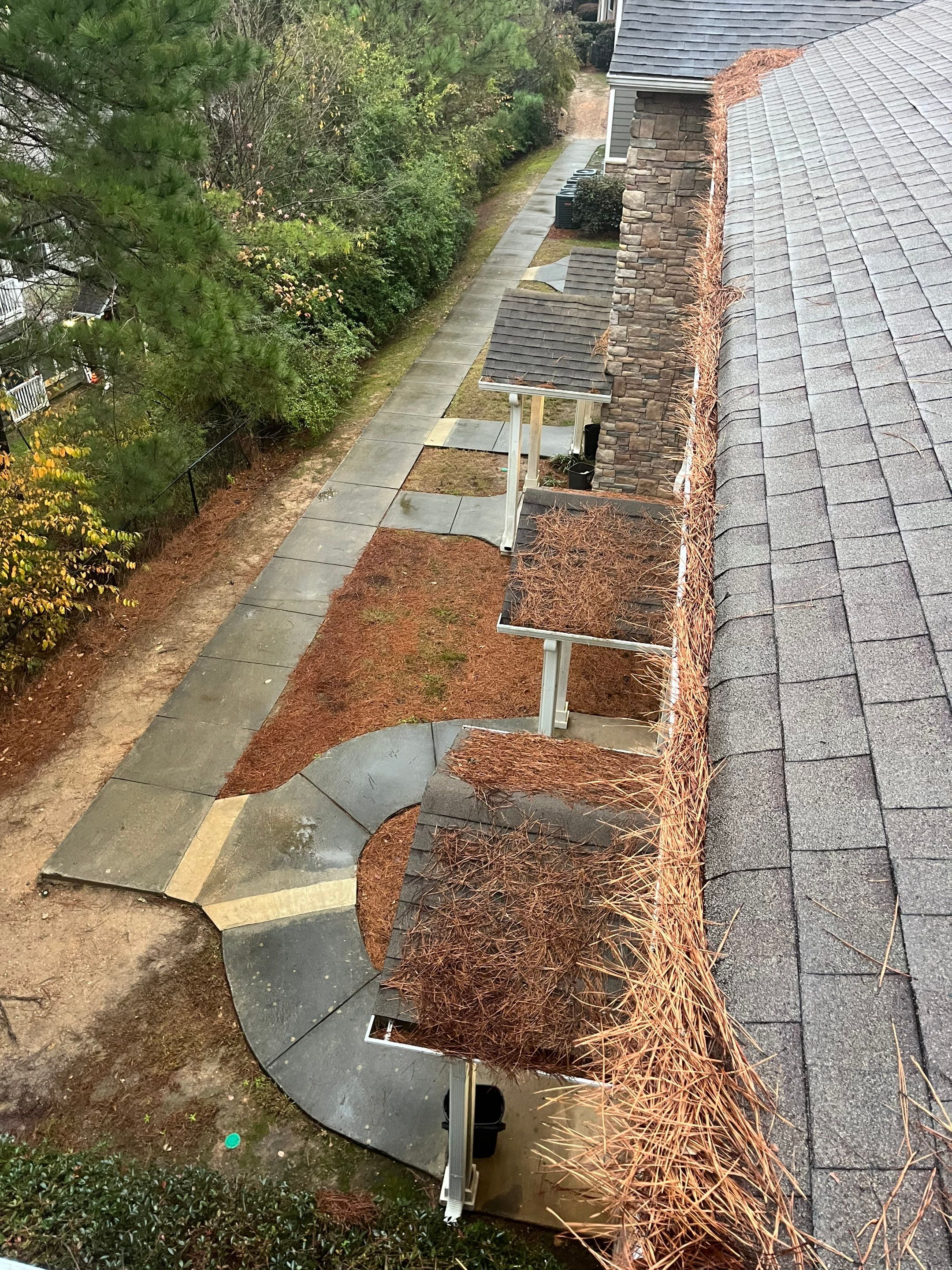 Commercial gutter cleaning Birmingham, AL before photo with filled gutters