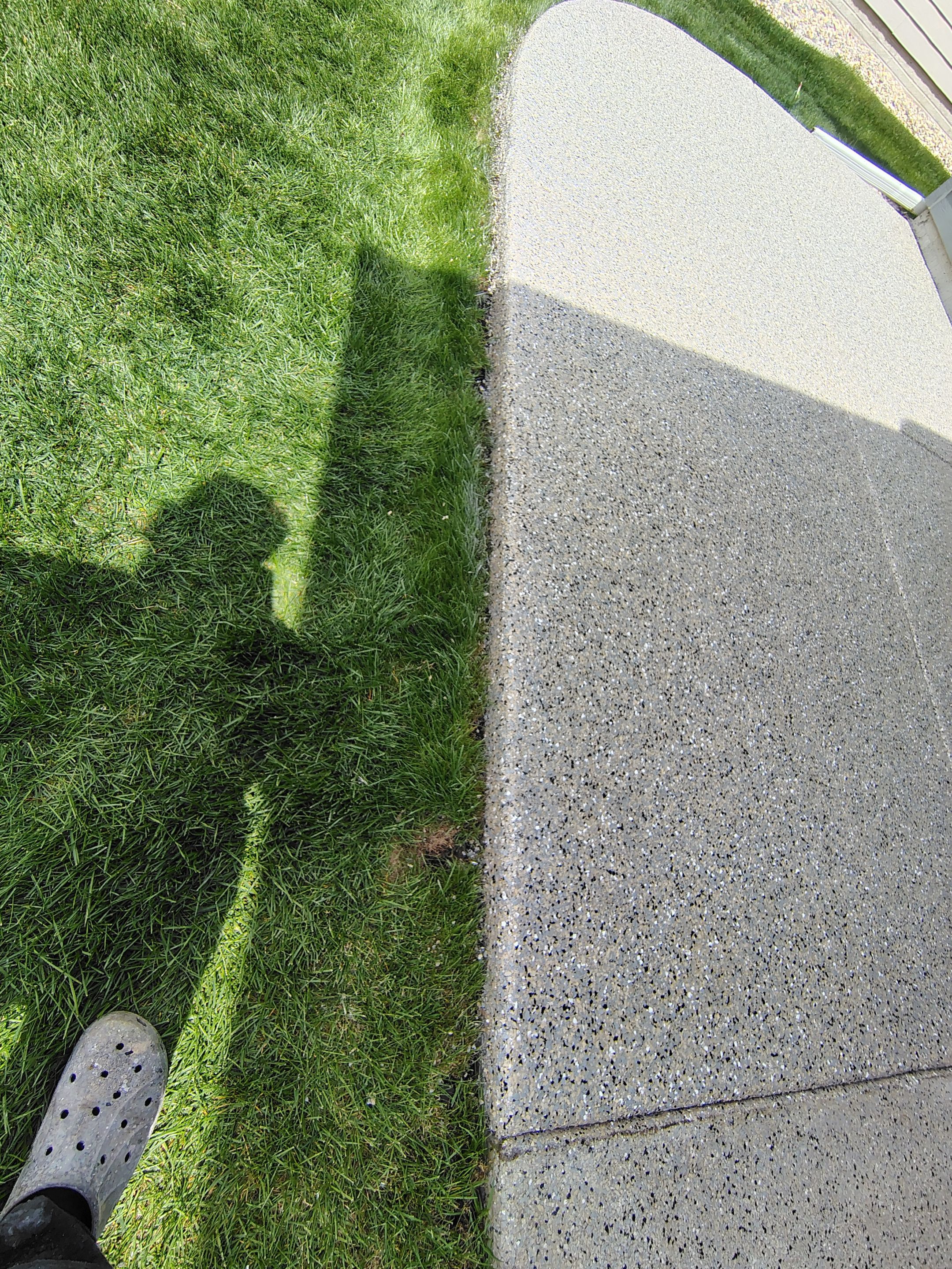Speckled Concrete Patio Coating Installation in Sioux Falls by Select Painting, Coatings & Garage Cabinets