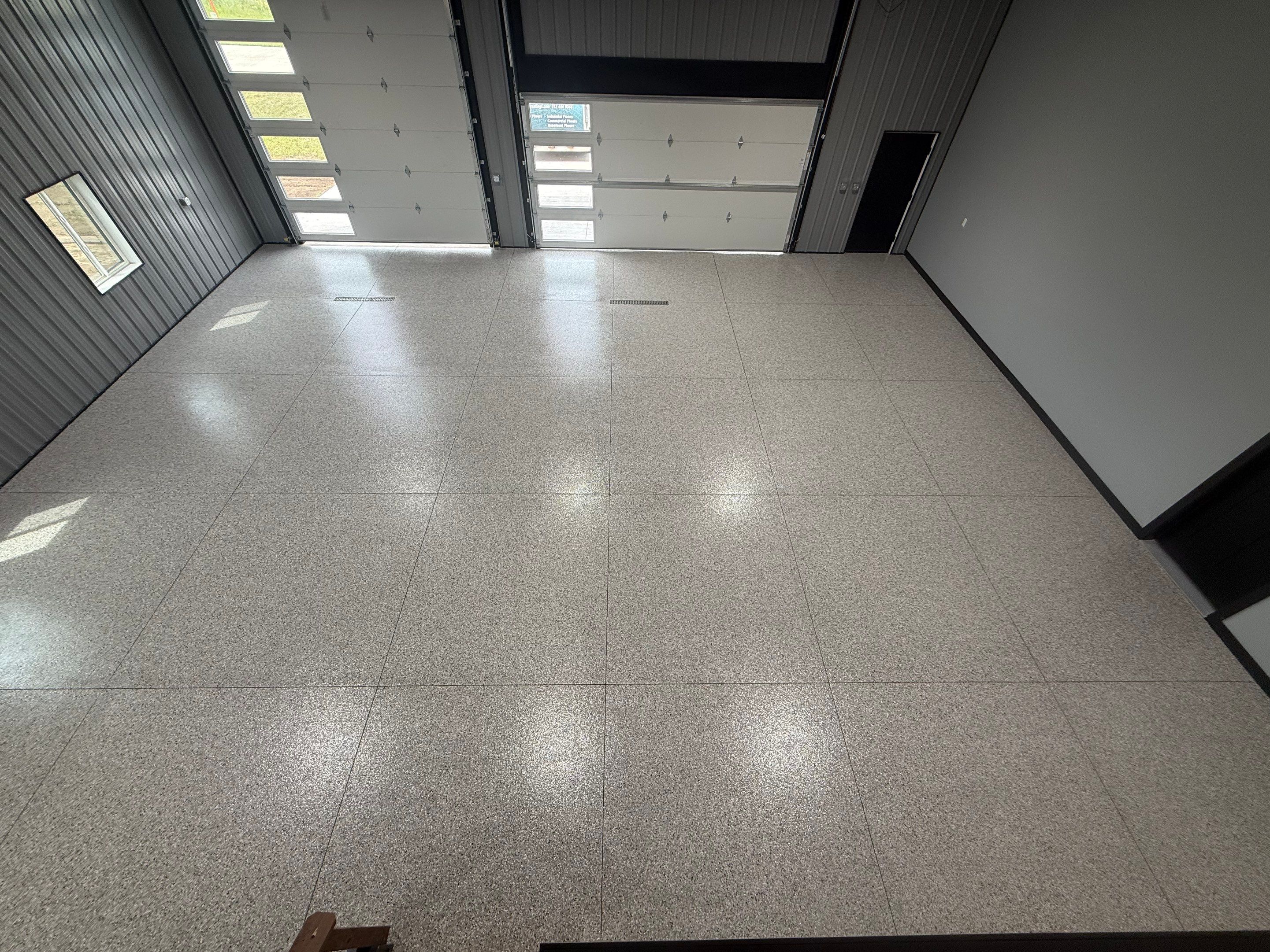 Polyaspartic Garage Floor Coating with Decorative Flake in Wentworth by Select Painting, Coatings & Garage Cabinets