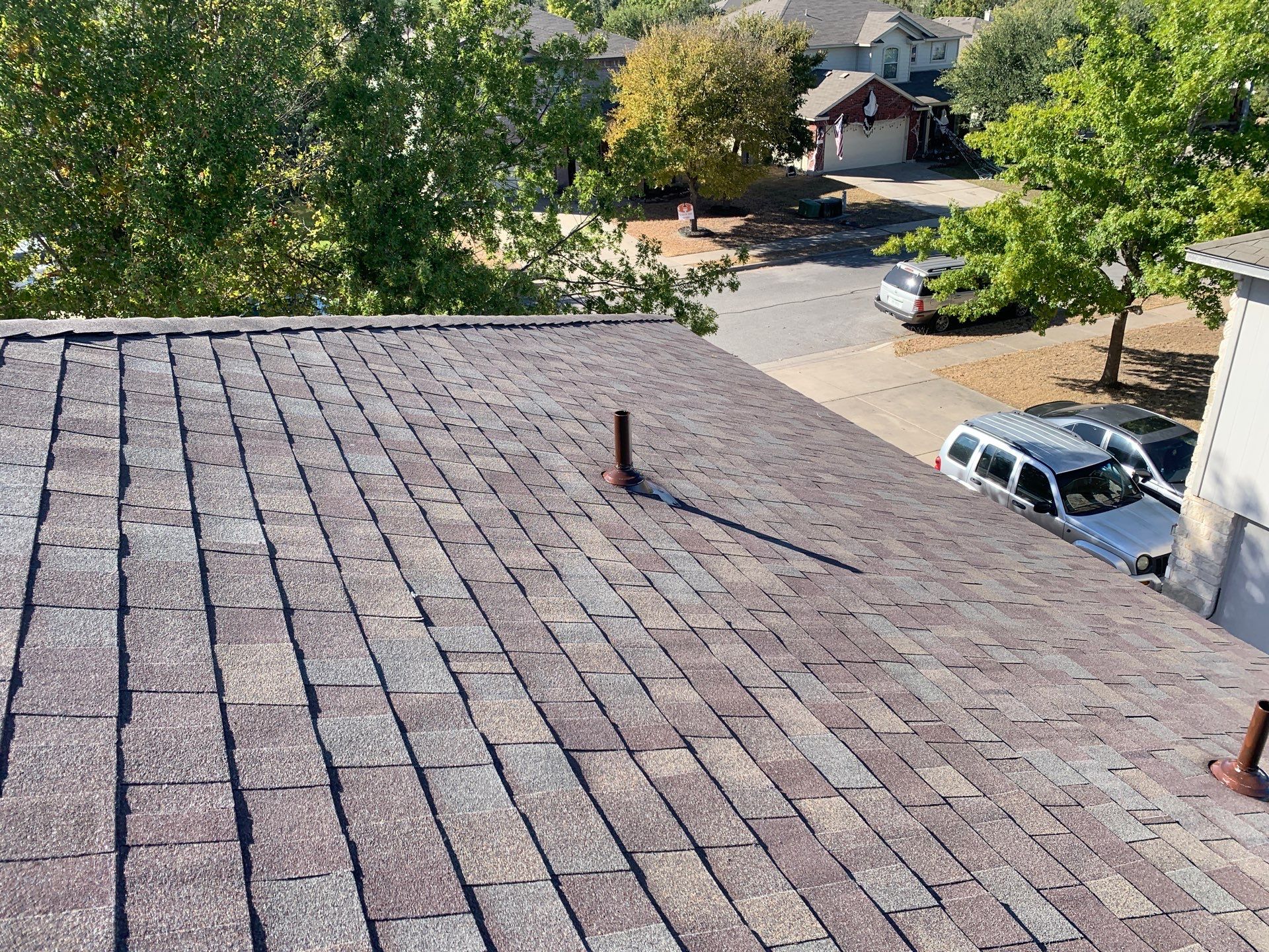 Asphalt Shingle Roof Replacement and Hail Damage Restoration in Hutto by Caliber Restoration LLC