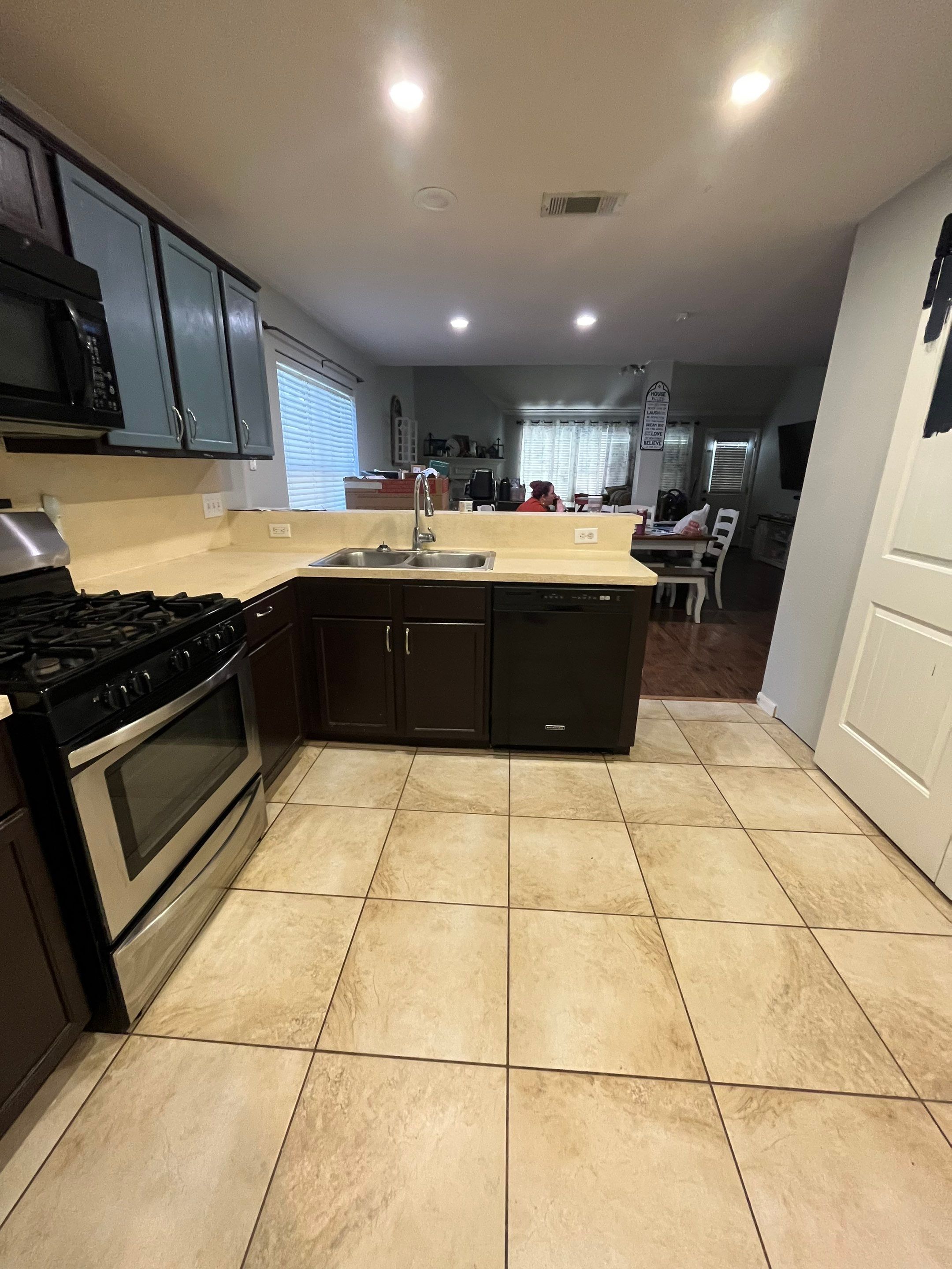 Modern Kitchen Remodel with Blue Cabinetry by Majesty Construction