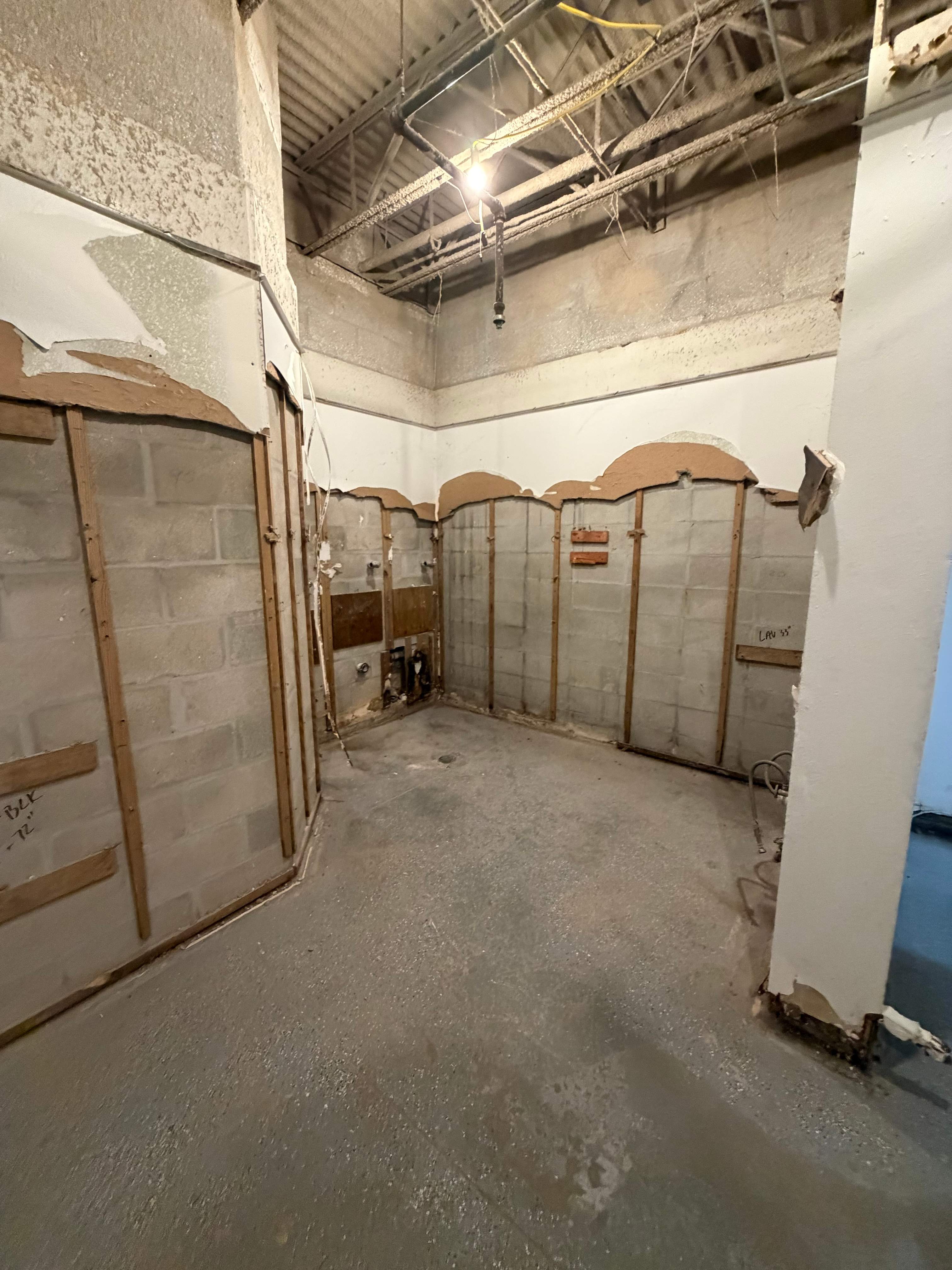 Commercial Restroom Renovation with Epoxy Flooring in Sarasota by Vertical General Contracting 