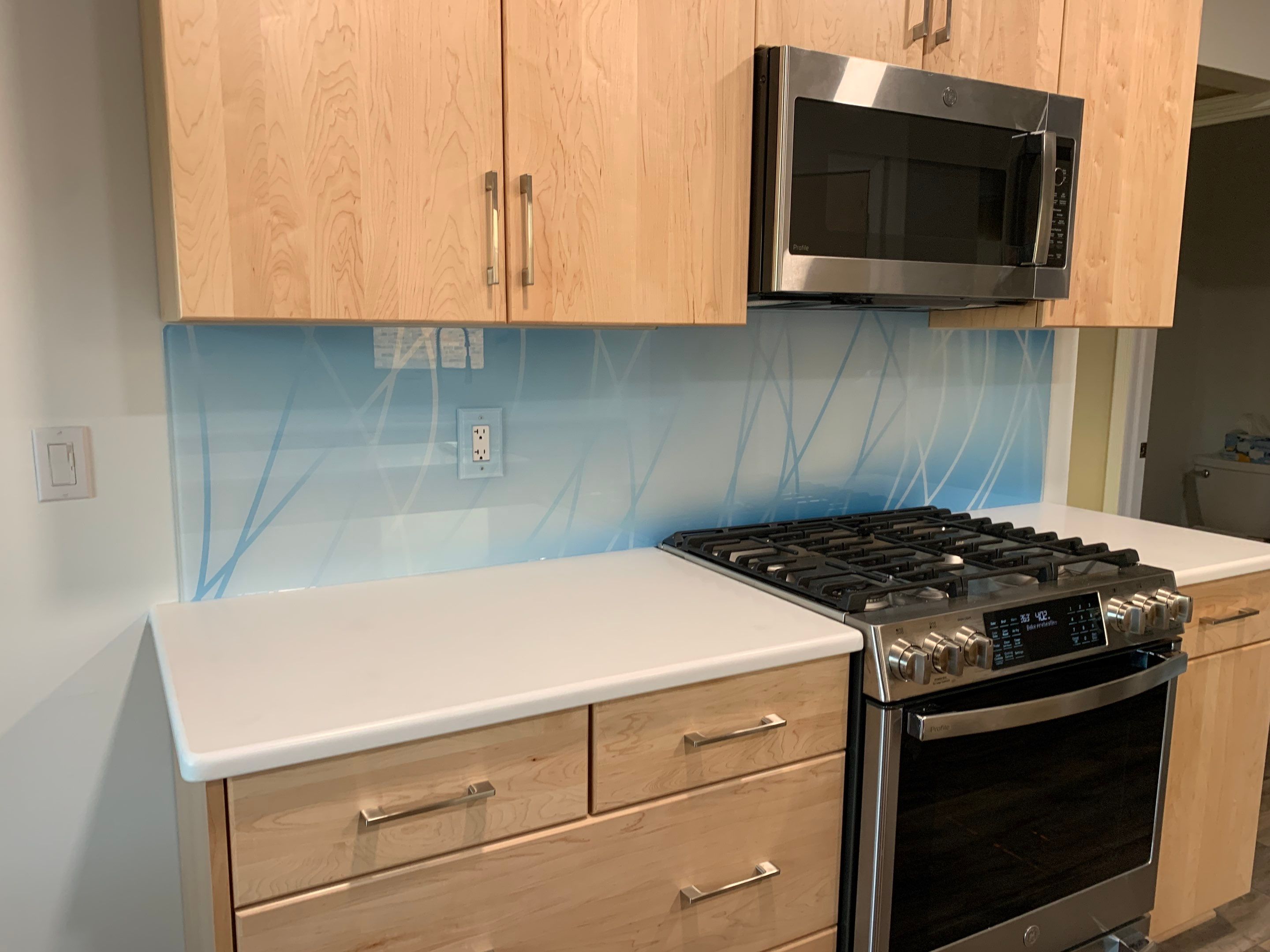 Kitchen Remodel using Misty Curves Blue IMAGIO Solid Glass Backsplash by IMAGIO