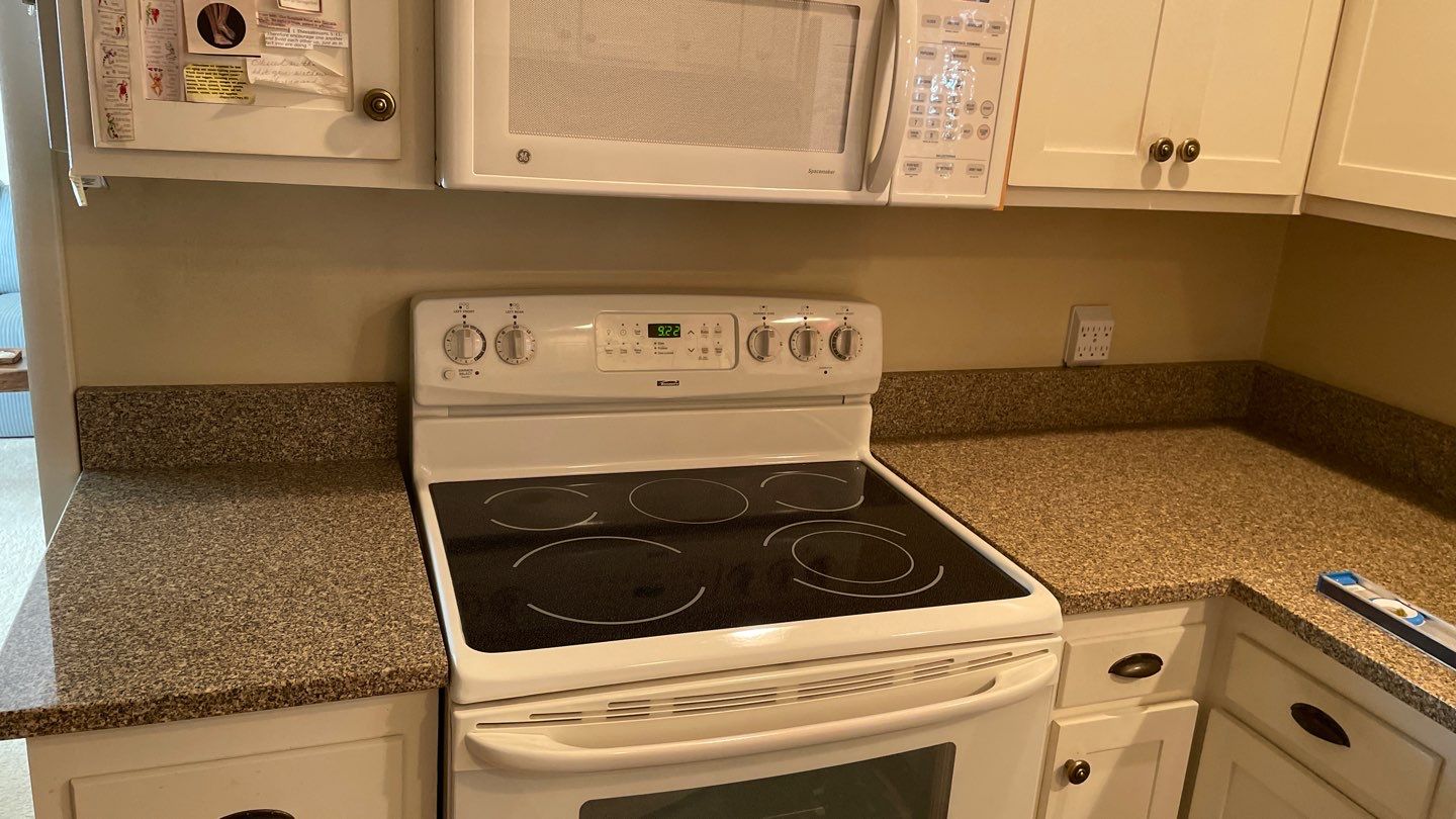 New Backsplash to Compliment the Countertops by Footprints Floors of Coastal Carolina