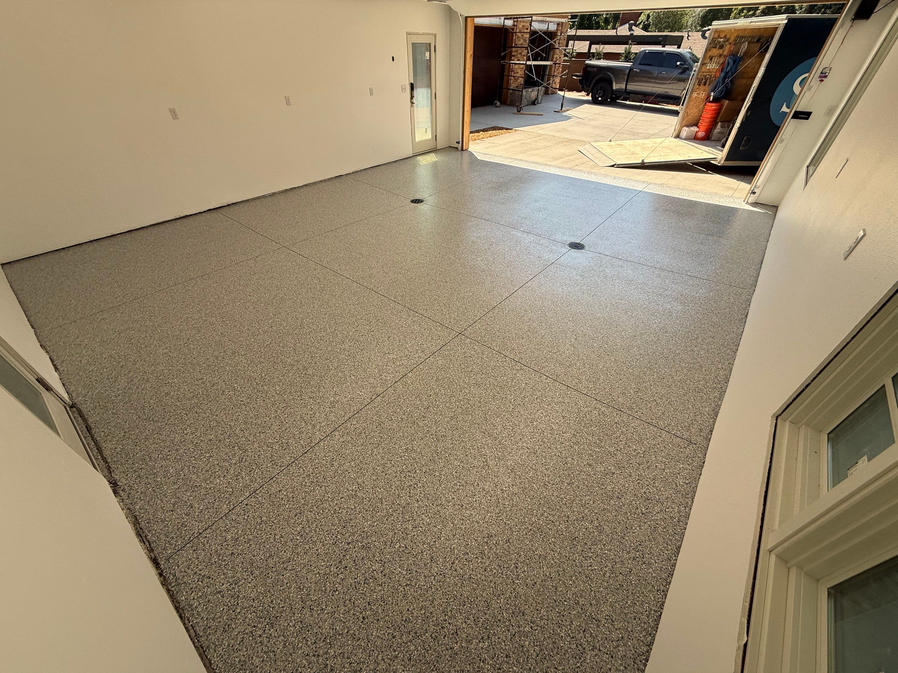 Multi-Car Garage Floor Coating Installation in Sioux Falls by Select Painting, Coatings & Garage Cabinets