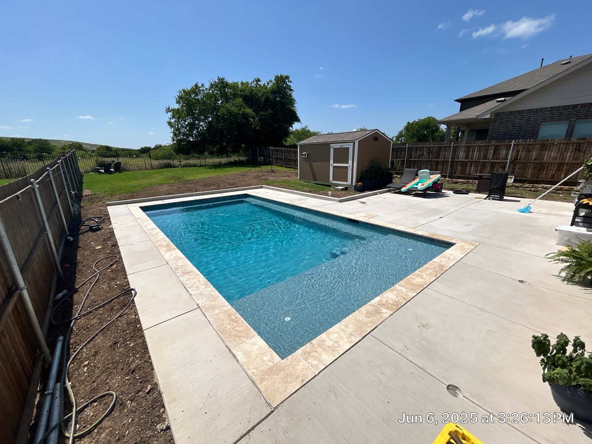 Classic Geometric Pool with Expansive Decking by Pinnacle Pools and Spas - DFW