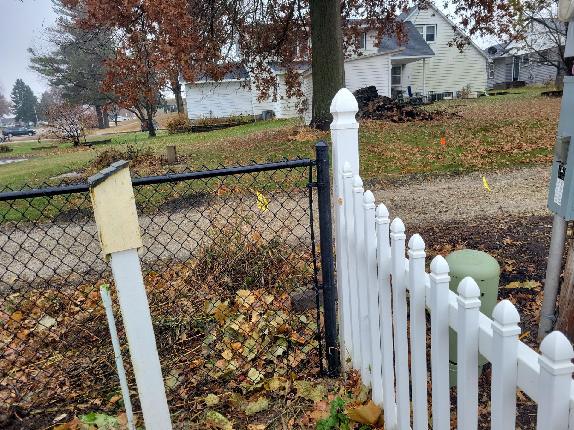 Black Vinyl-Coated Chain Link Fence Installation in Aplington by Perfect Picket Fence and Stain