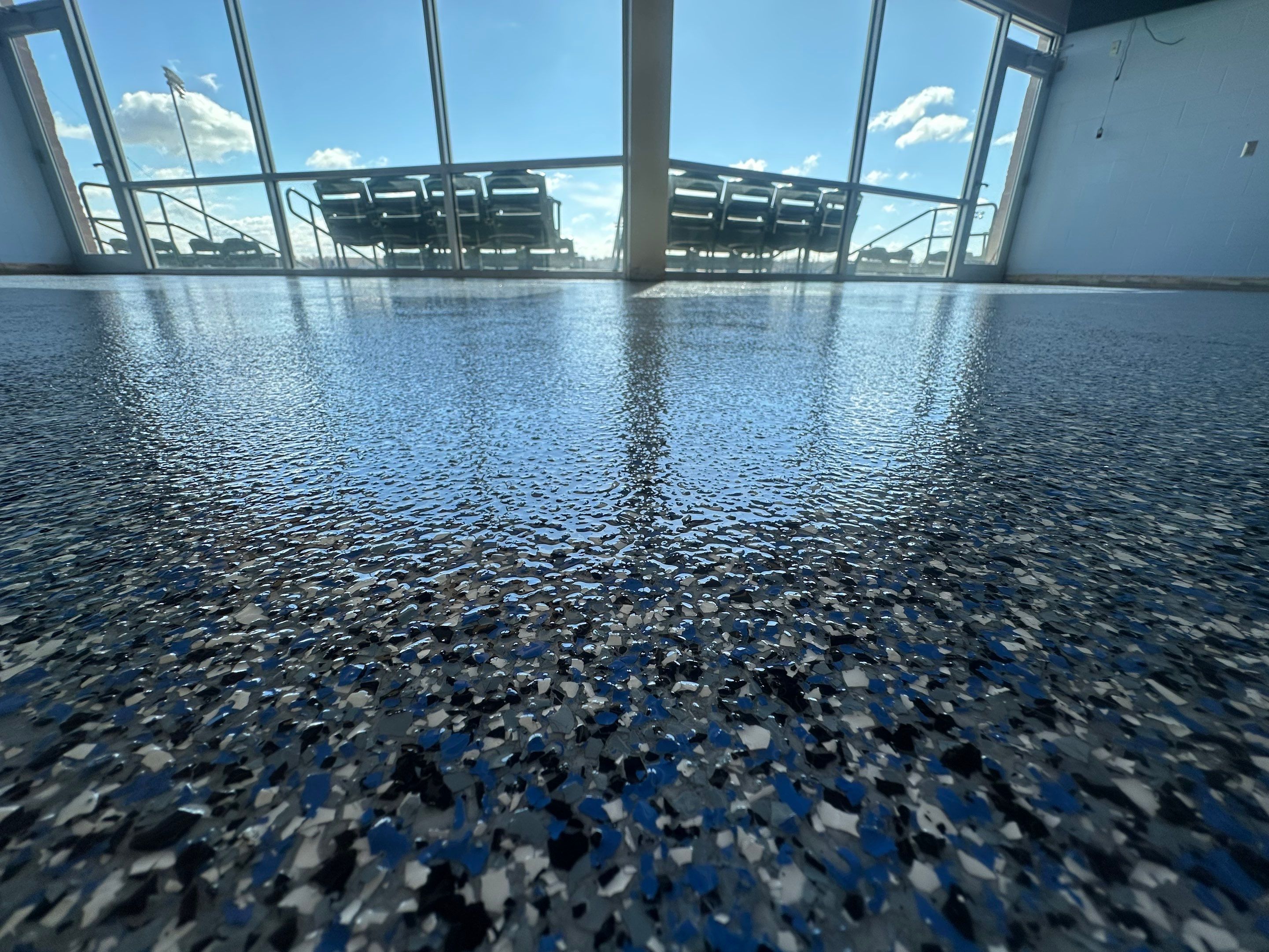 Commercial Epoxy Floor Coating for Stadium Viewing Suites in Sioux Falls by Select Painting, Coatings & Garage Cabinets