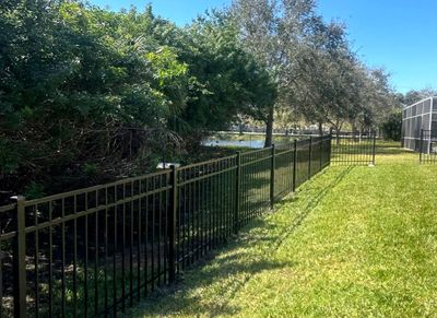 Aluminum Fence Installation using Black 3 Rail Aluminum Fence
