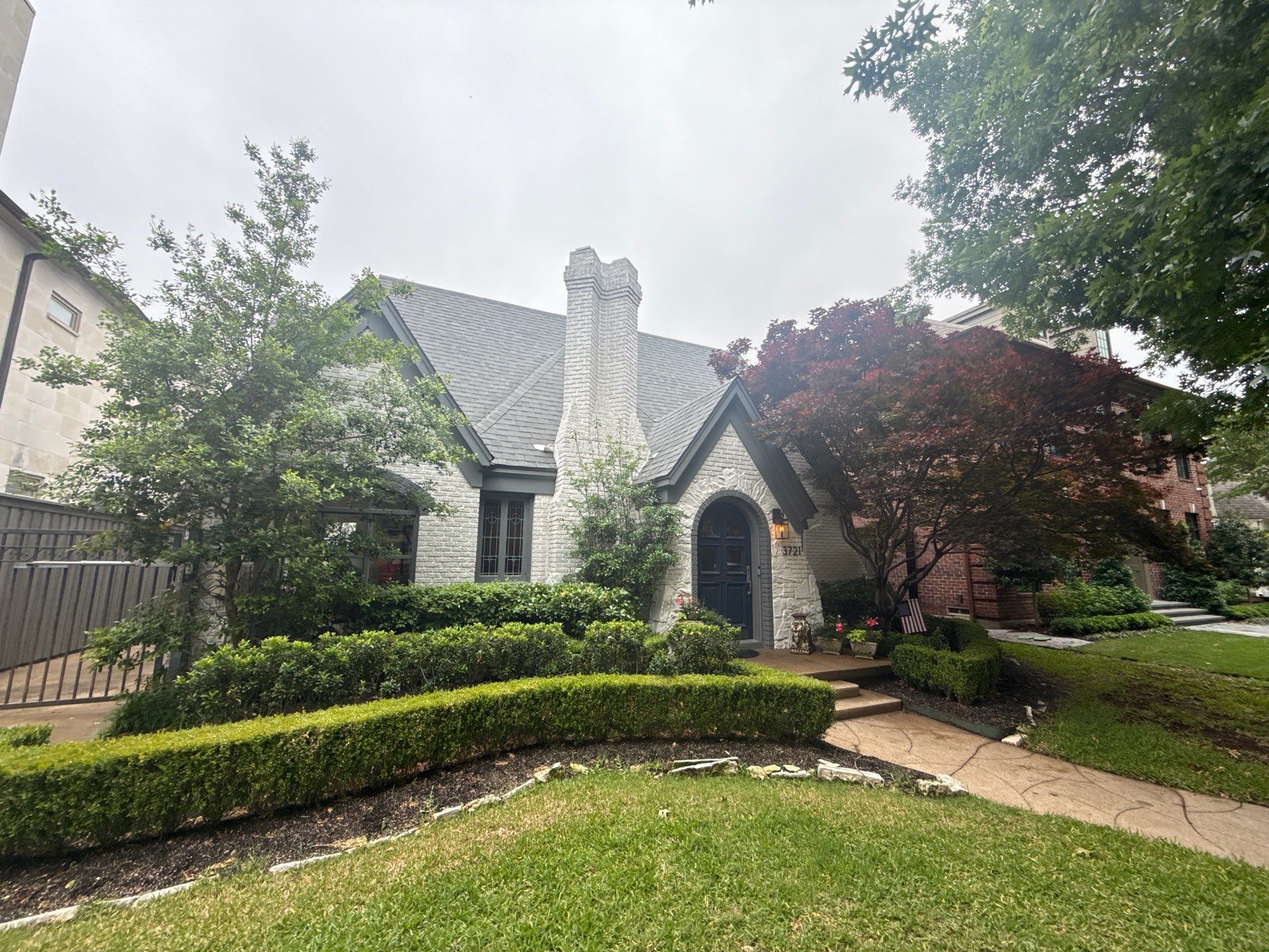 Residential Gutter Installation and Exterior Maintenance for Dallas White Brick Home by First Out Roofing 