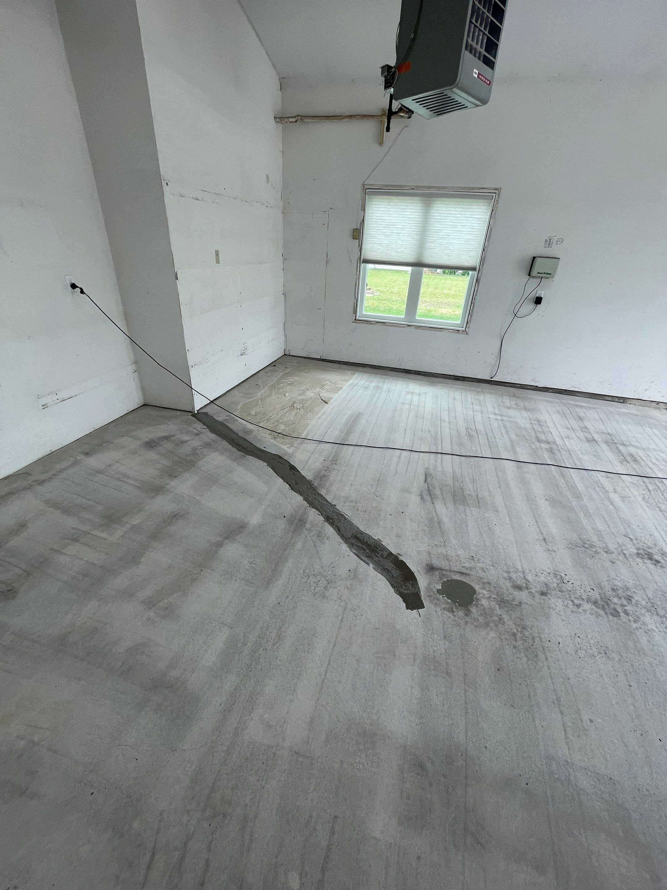 Coyote Flake Concrete Coating for Sioux Falls Garage by Select Painting, Coatings & Garage Cabinets