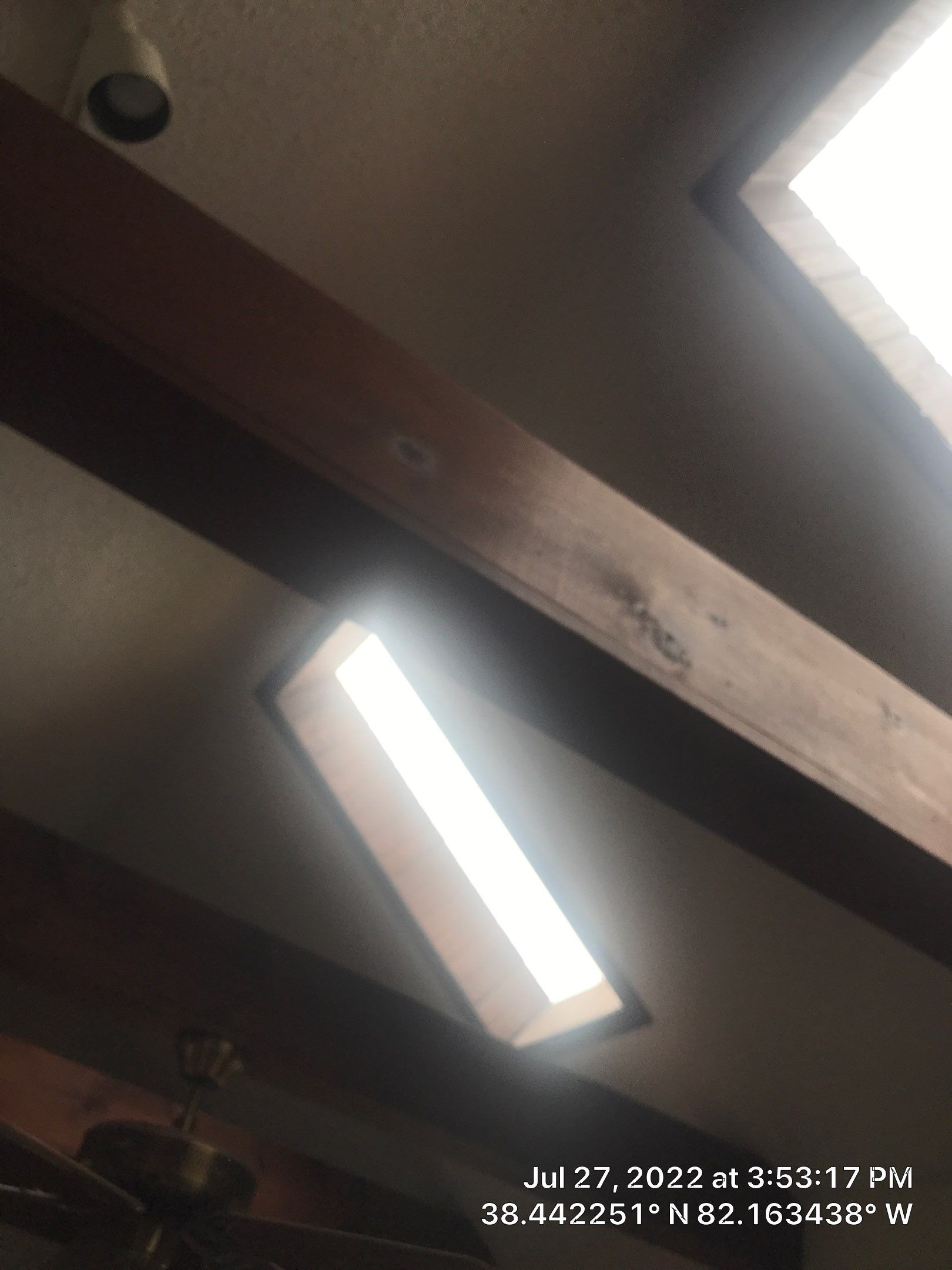 Shingle Roofing with Velux Skylight replacement and stone chimney flashing  by Secure Construction Company Inc
