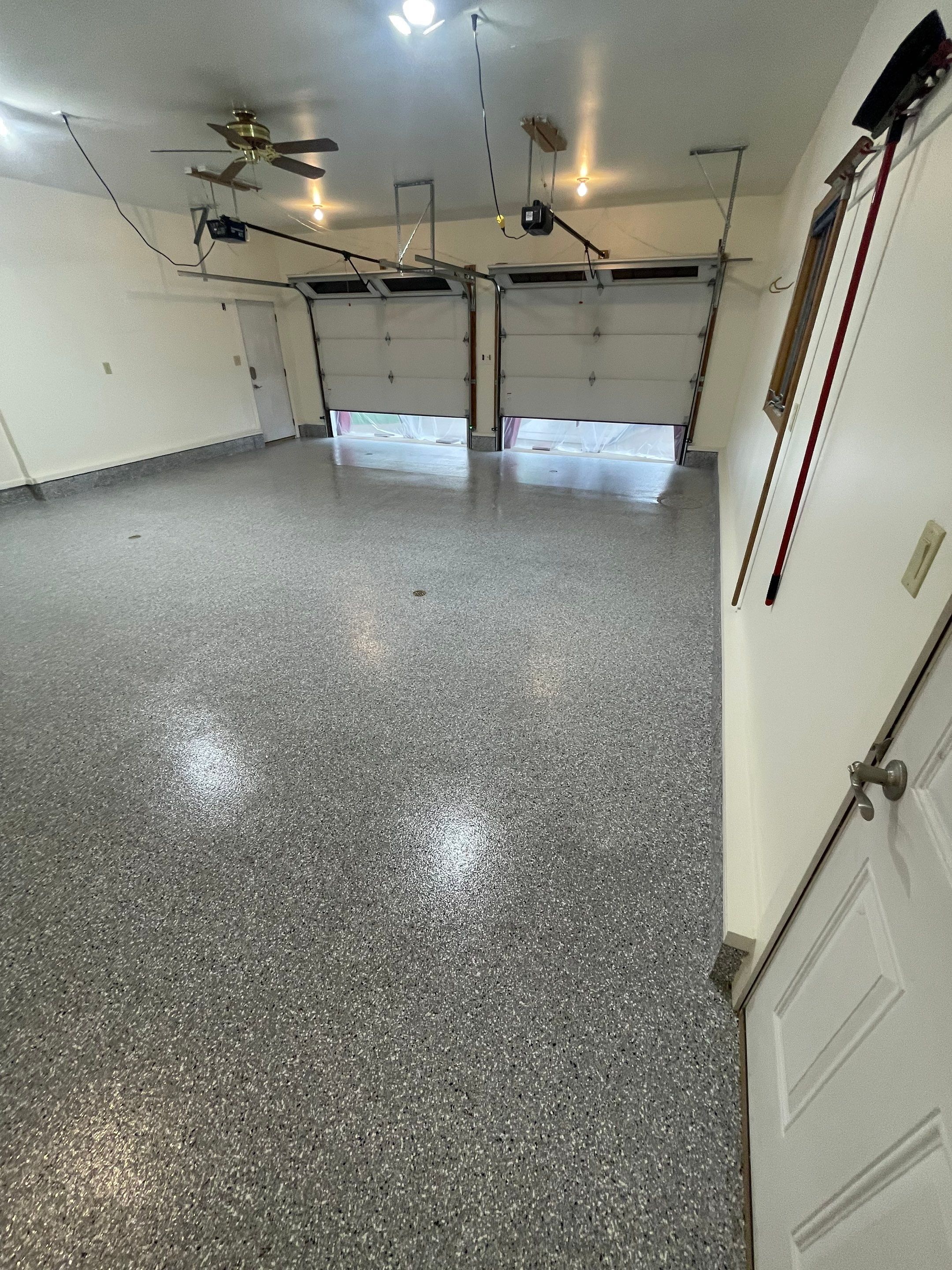 Madison Garage Concrete Coating with Feather Grey Speckle Finish by Select Painting, Coatings & Garage Cabinets