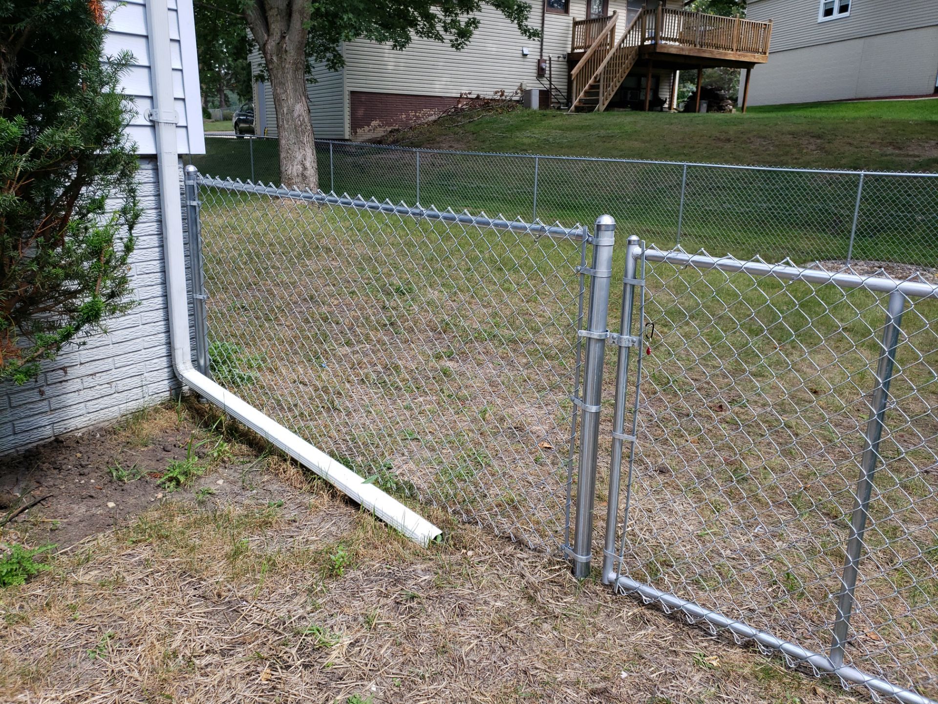 Galvanized Chain Link Backyard Fence and Gate Installation in Cedar Falls by Perfect Picket Fence and Stain