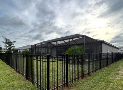 Aluminum Fence Installation using Black 3 Rail Aluminum Fence