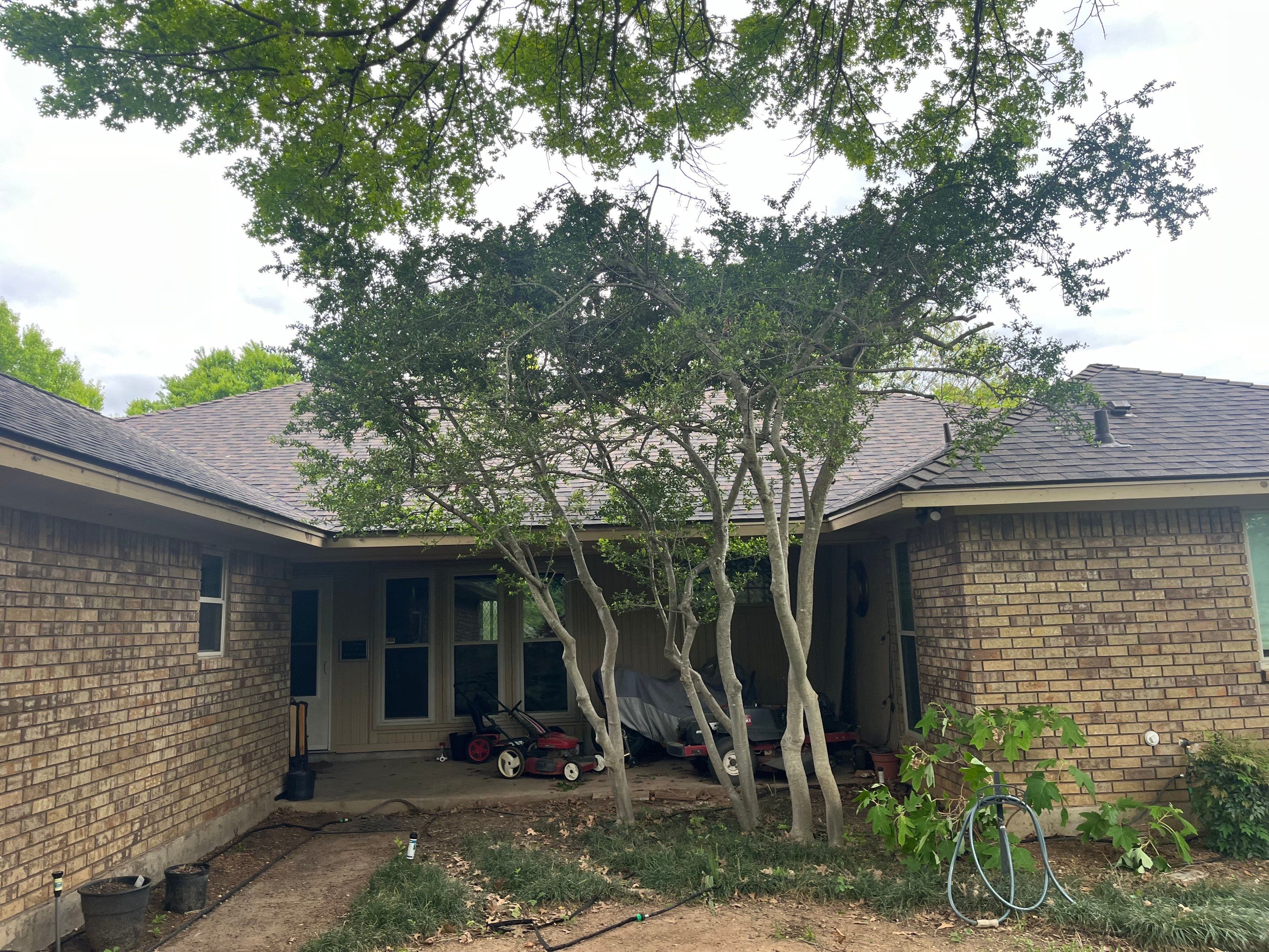 Brown brick with IKO Shadow Brown by Tejas Roofworks + Restoration