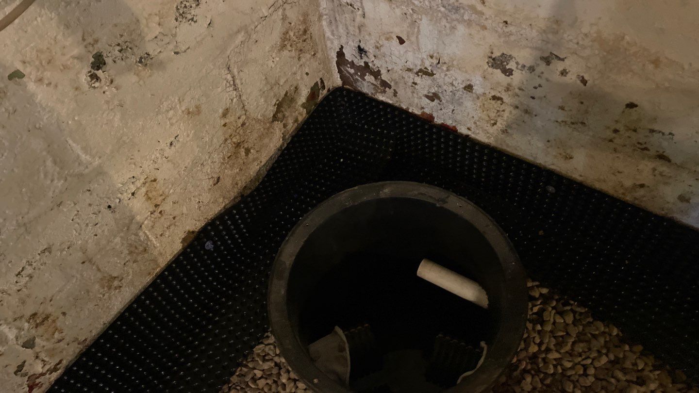 Interior Drain Tile & Sump Pump System in North Minneapolis by Waterproofing Northeast