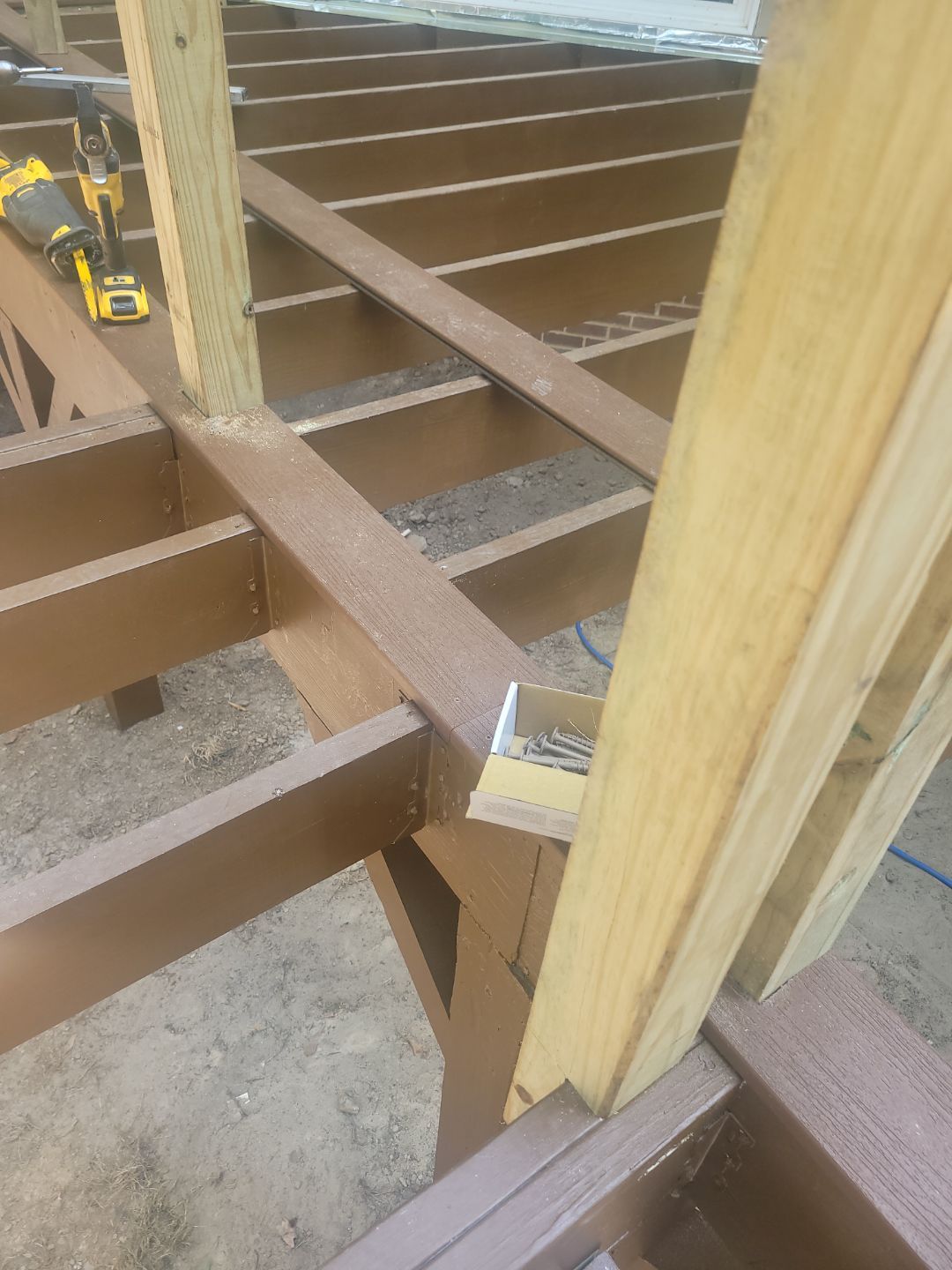 Fuquay-Varina Outdoor Upgrade – Composite Deck & Paved Landing by Elite Remodeling and Design LLC