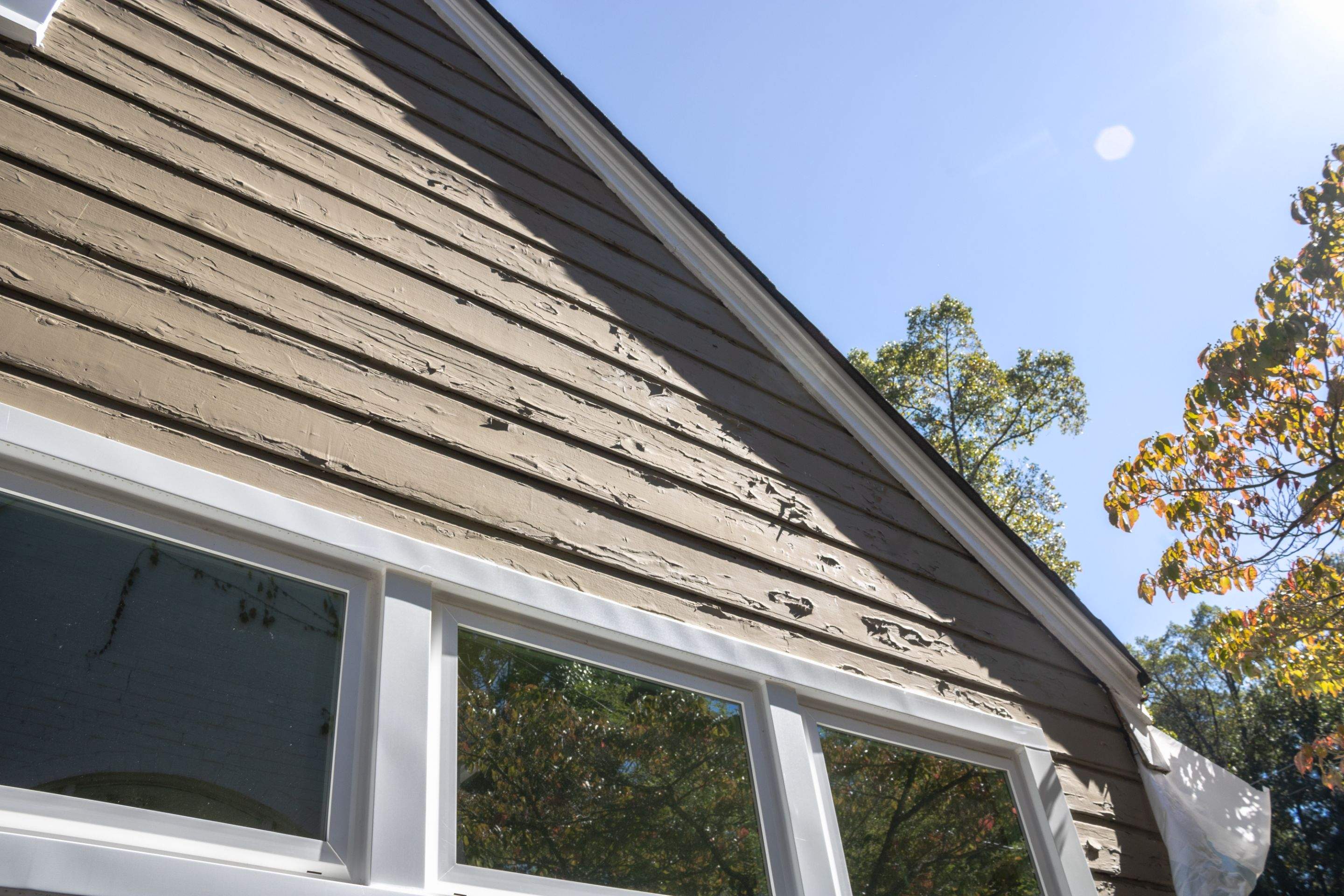 Full Siding Replacement, Deck Build, Exterior Paint, and Gutter Replacement  by Nelson Exteriors 