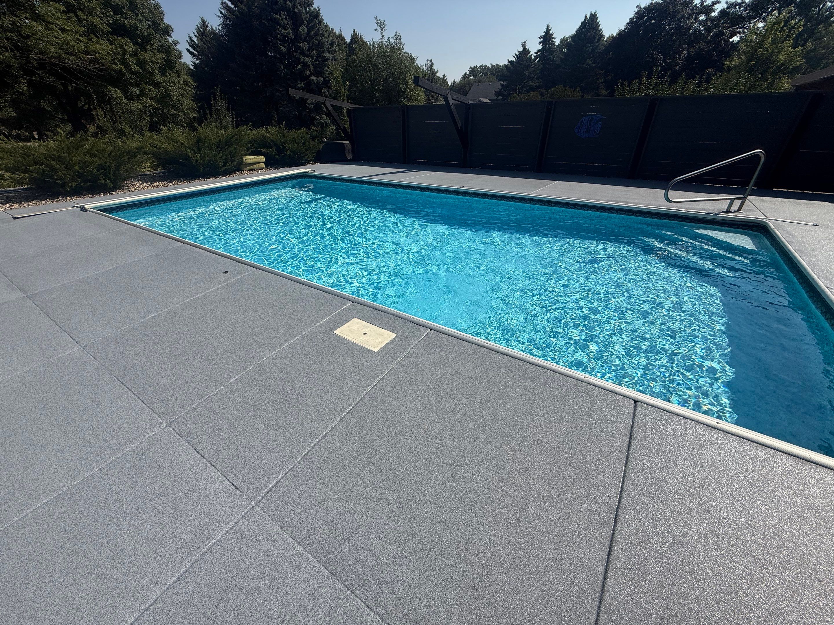 Garage Floor and Textured Pool Deck Coating in Sioux Falls by Select Painting, Coatings & Garage Cabinets