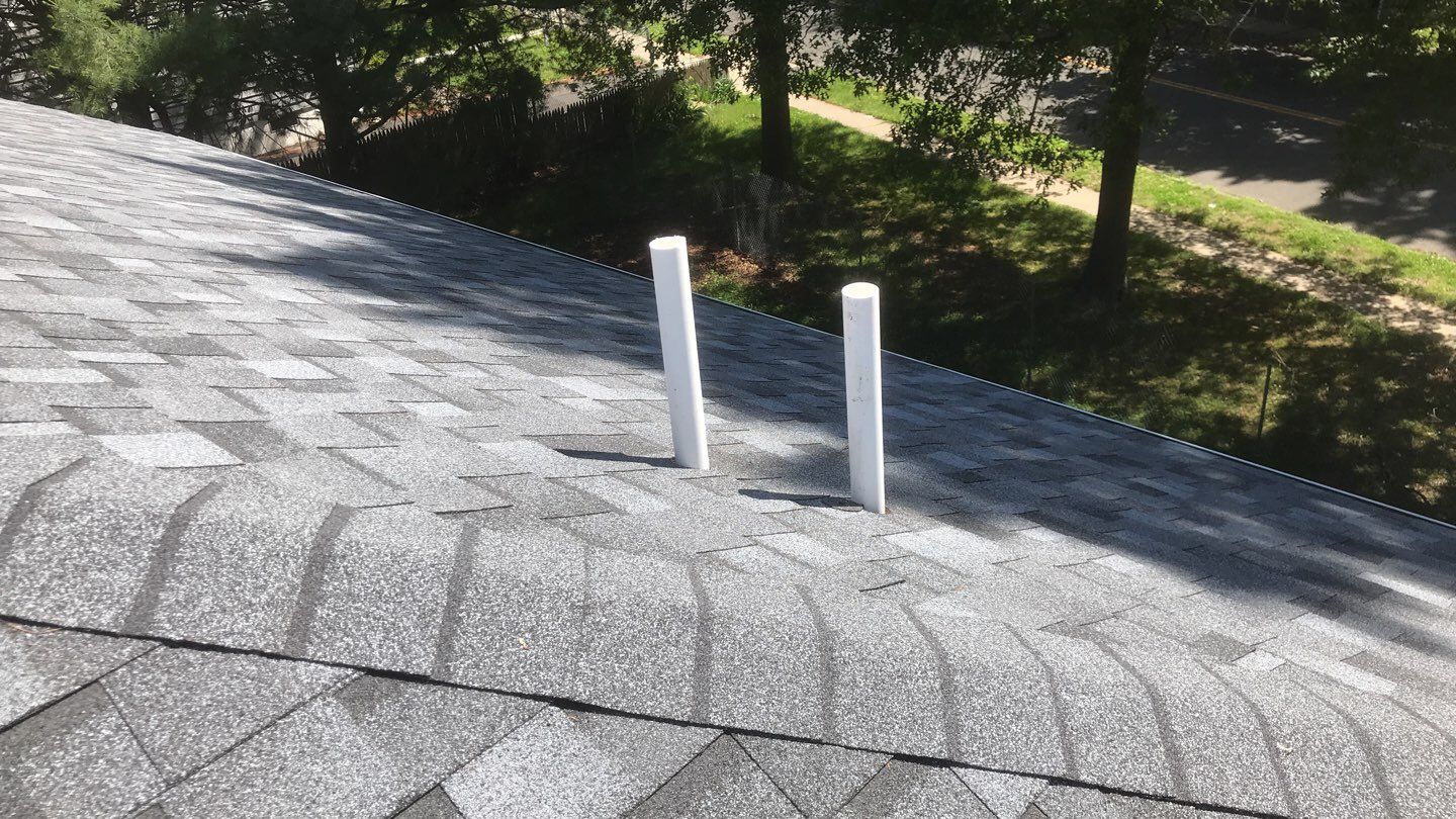 Commercial Roofing Installation using EPDM with white gutters by A Plus Exterior