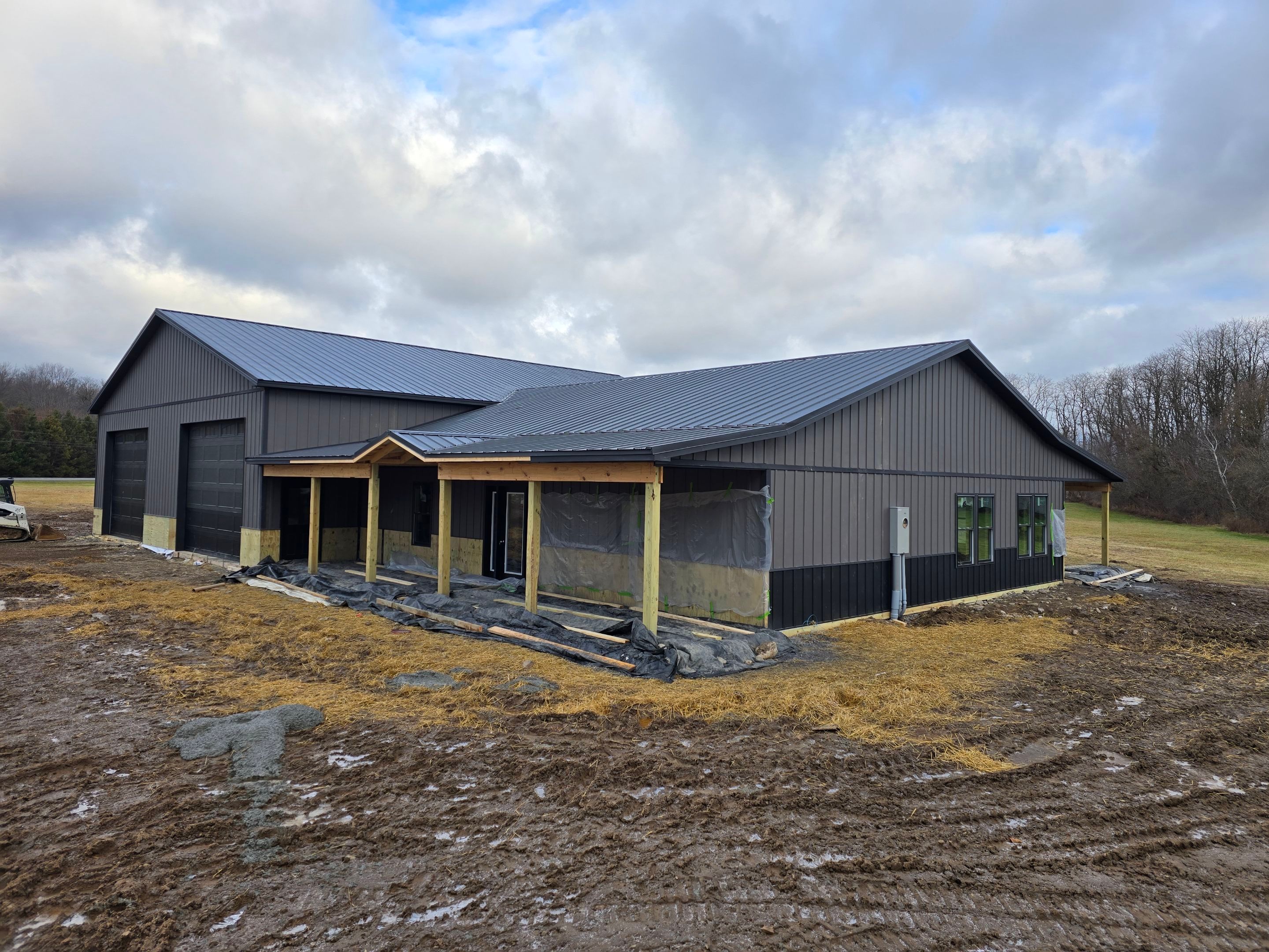 Barndominium  using Textured Board & Batton by Horst Custom Homes 