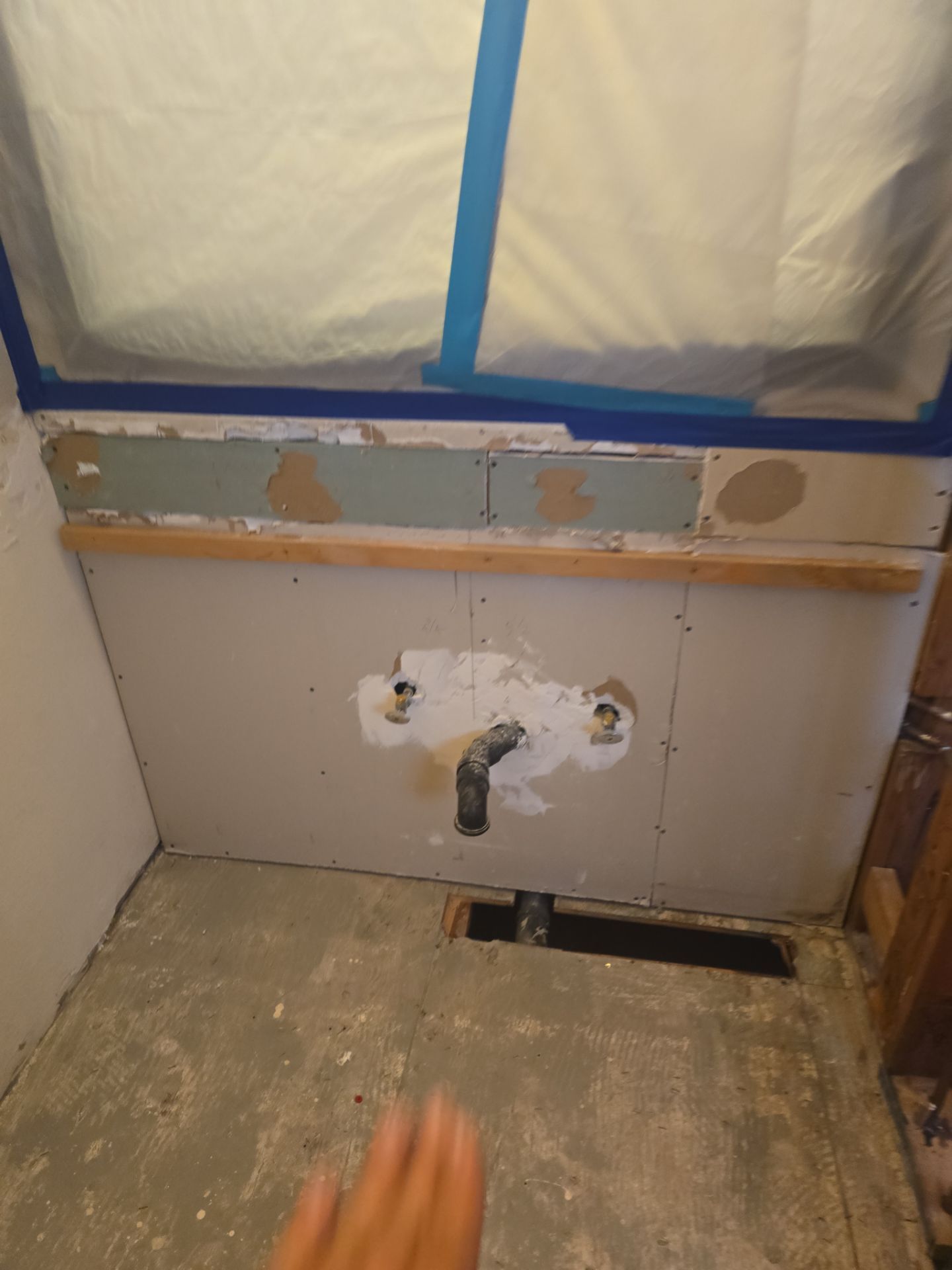 Inspecting Water Leak in Shower by Us Plumbing
