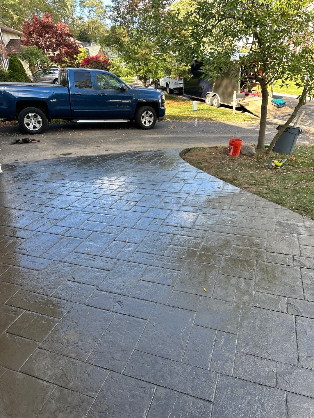 Ashlar slate stamped concrete patio  by NG Masonry & Construction LLC