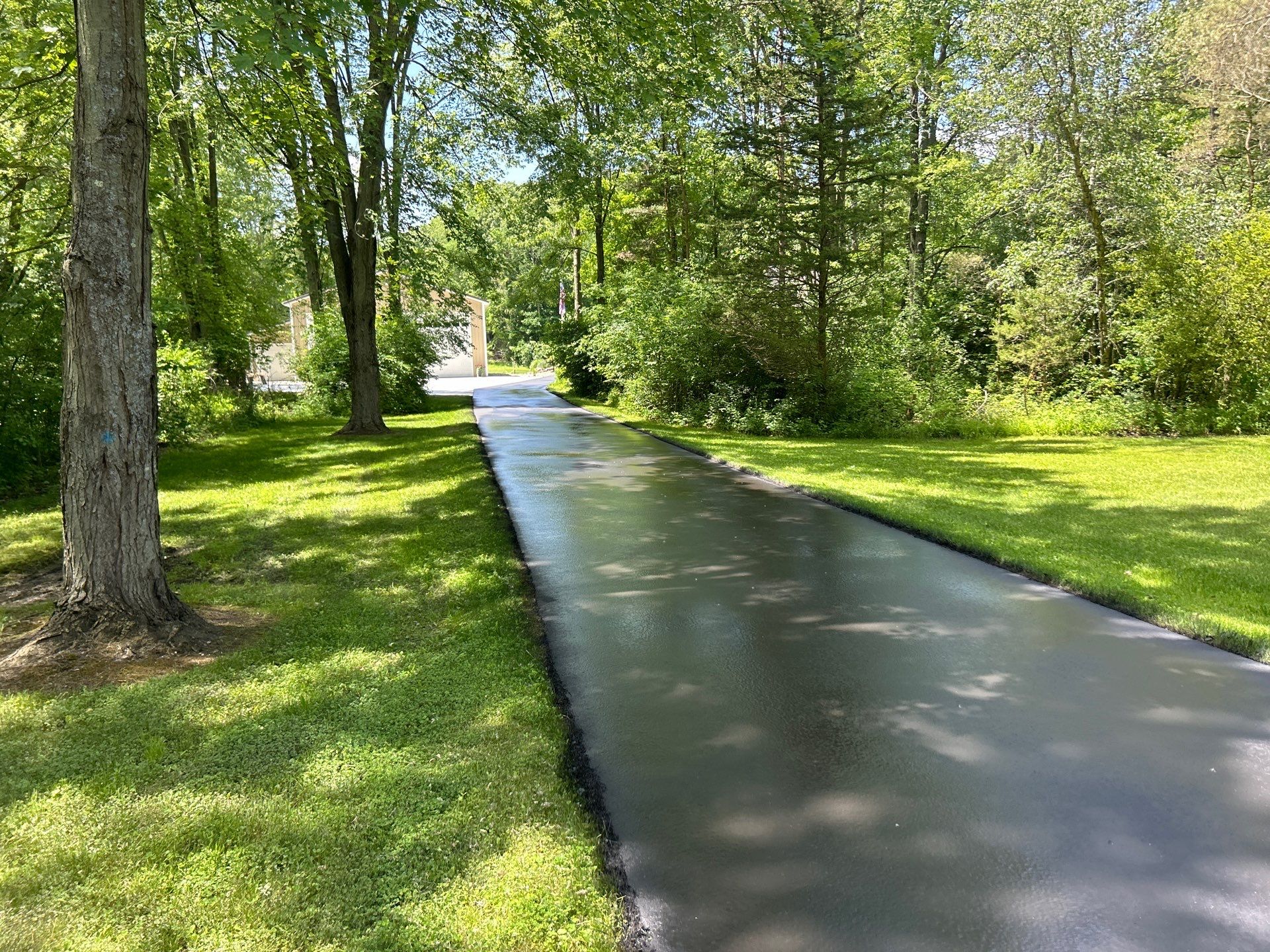 High end residential driveway by Quality Asphalt & Maintenance LLC