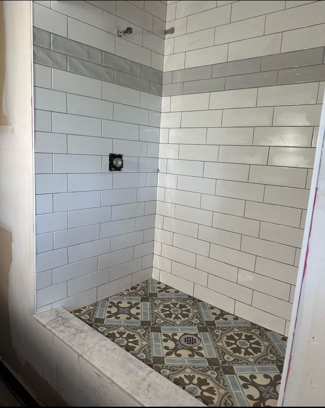 Jack & Jill Bathroom Floor + Dog Washing Nook with Niche using Porceline Subway Tile by Footprints Floors Morristown