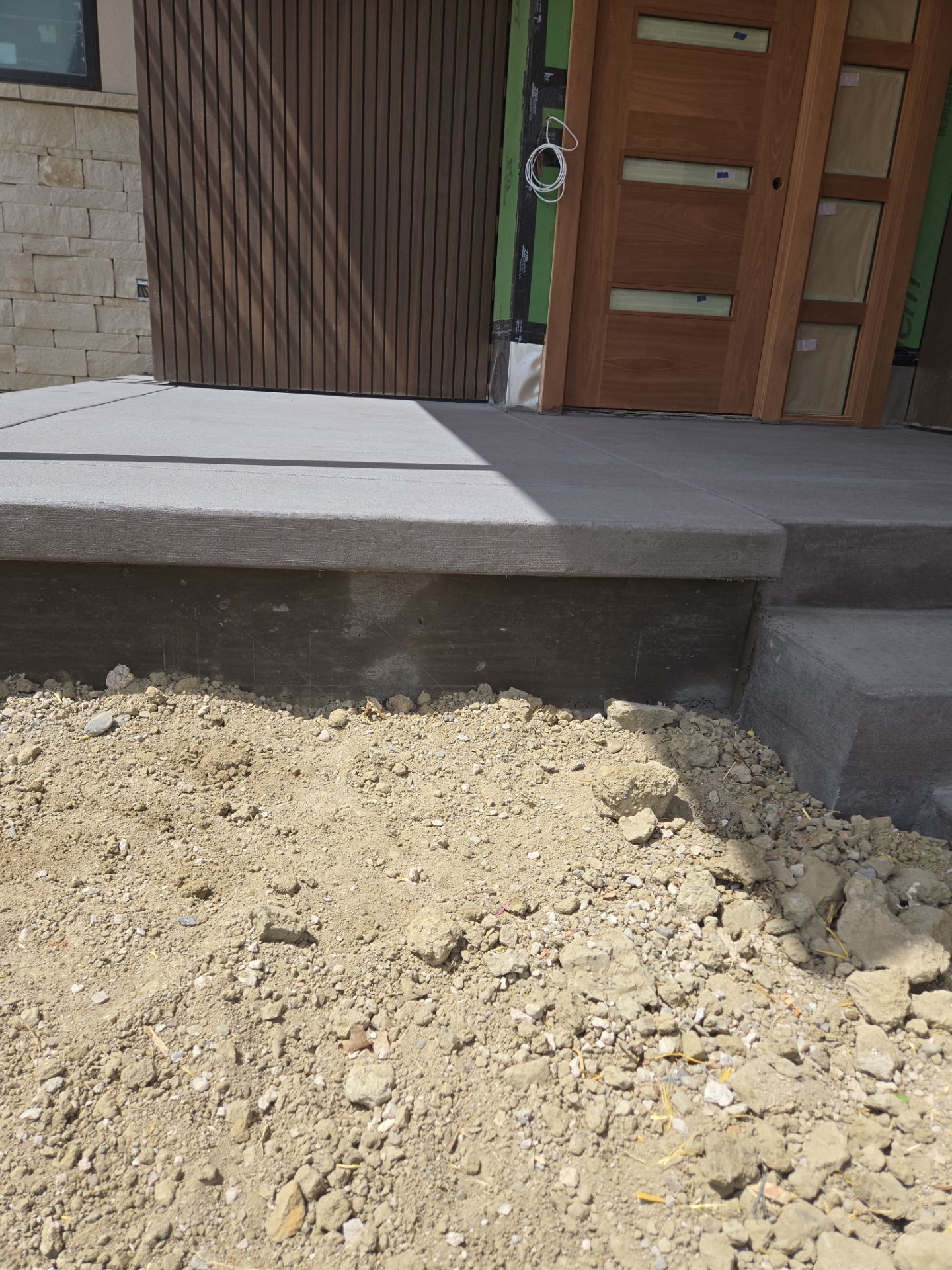 Stamped Concrete Patio and Custom Walkway Installation in Berthoud, Colorado by Center Line Concrete
