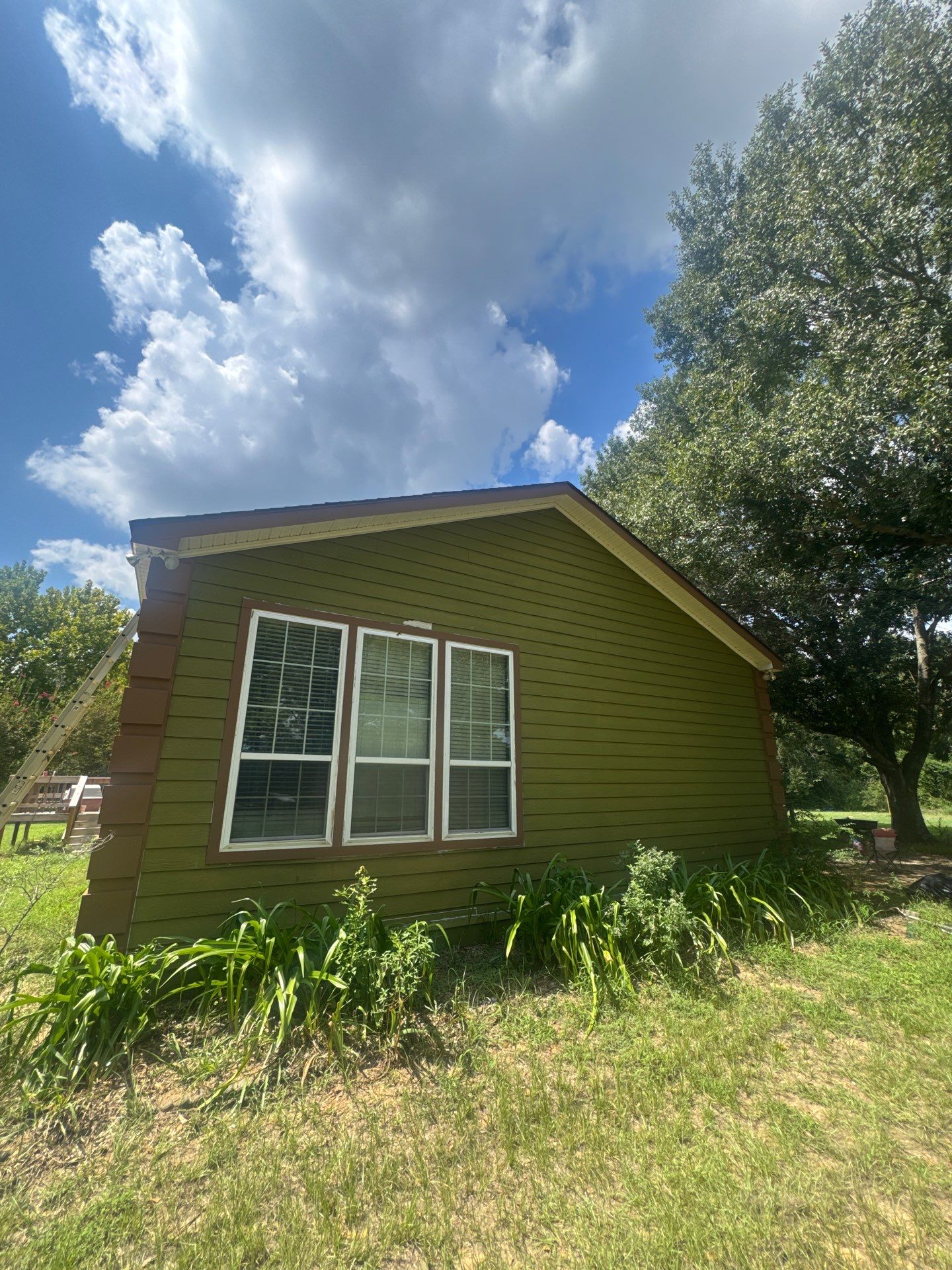 Exterior Painting in Lindale, TX | Bright Green Wood House Repaint by Quality Coats Painting