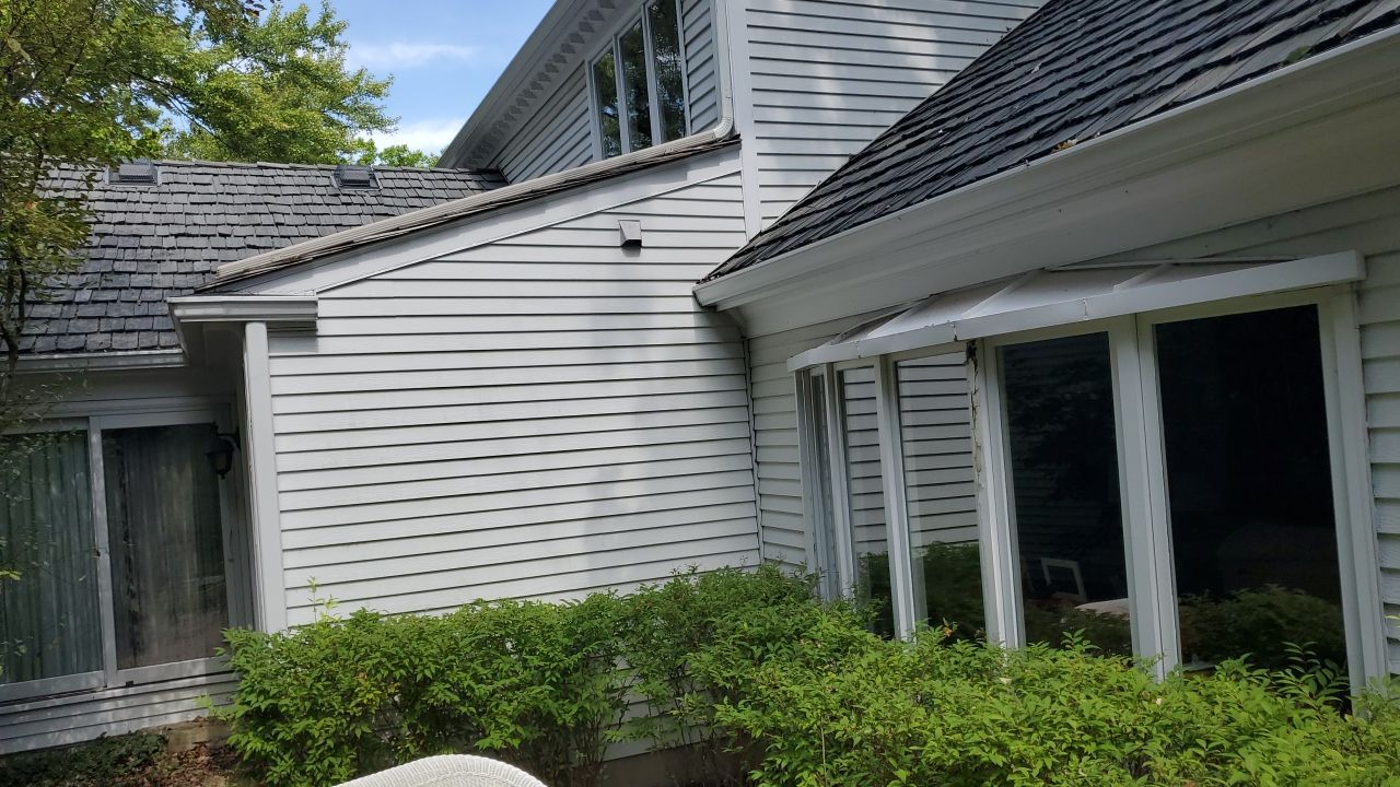 Housewashing  using Algaecide, soft wash soap by Northern Power Washing LLC.