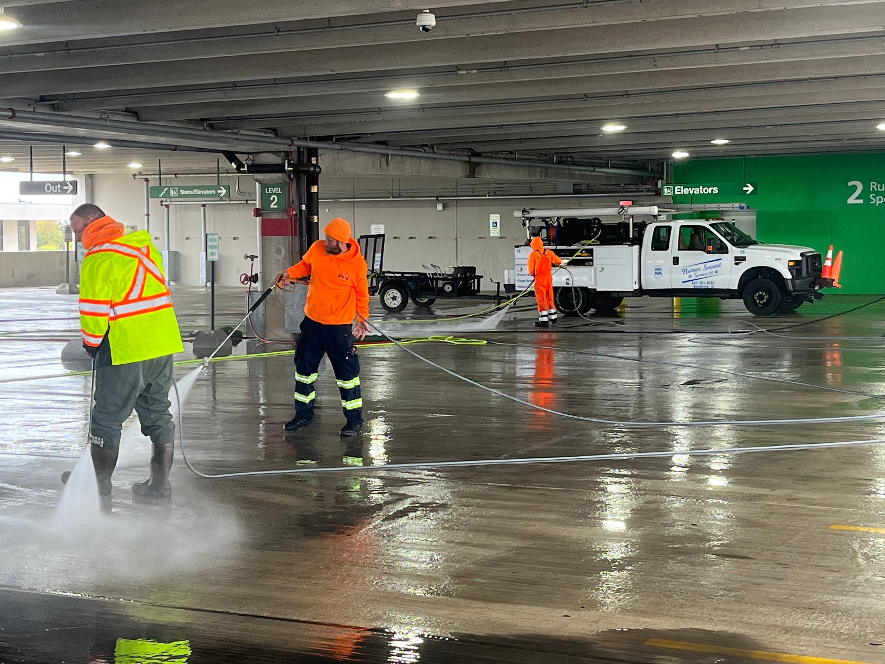 Parking garage using Hot water by Northern Power Washing LLC.