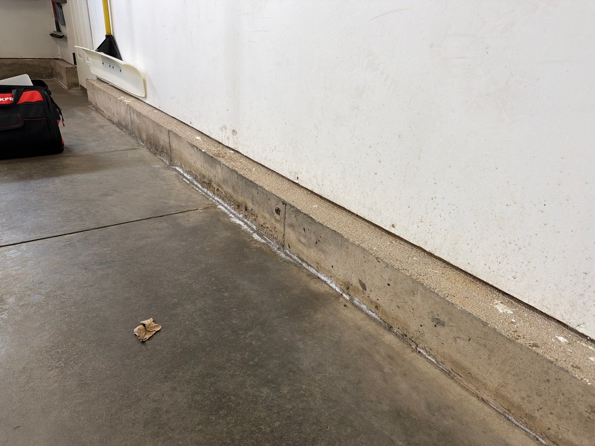 Feather Gray Epoxy Floor Coating Installation in Sioux Falls by Select Painting, Coatings & Garage Cabinets