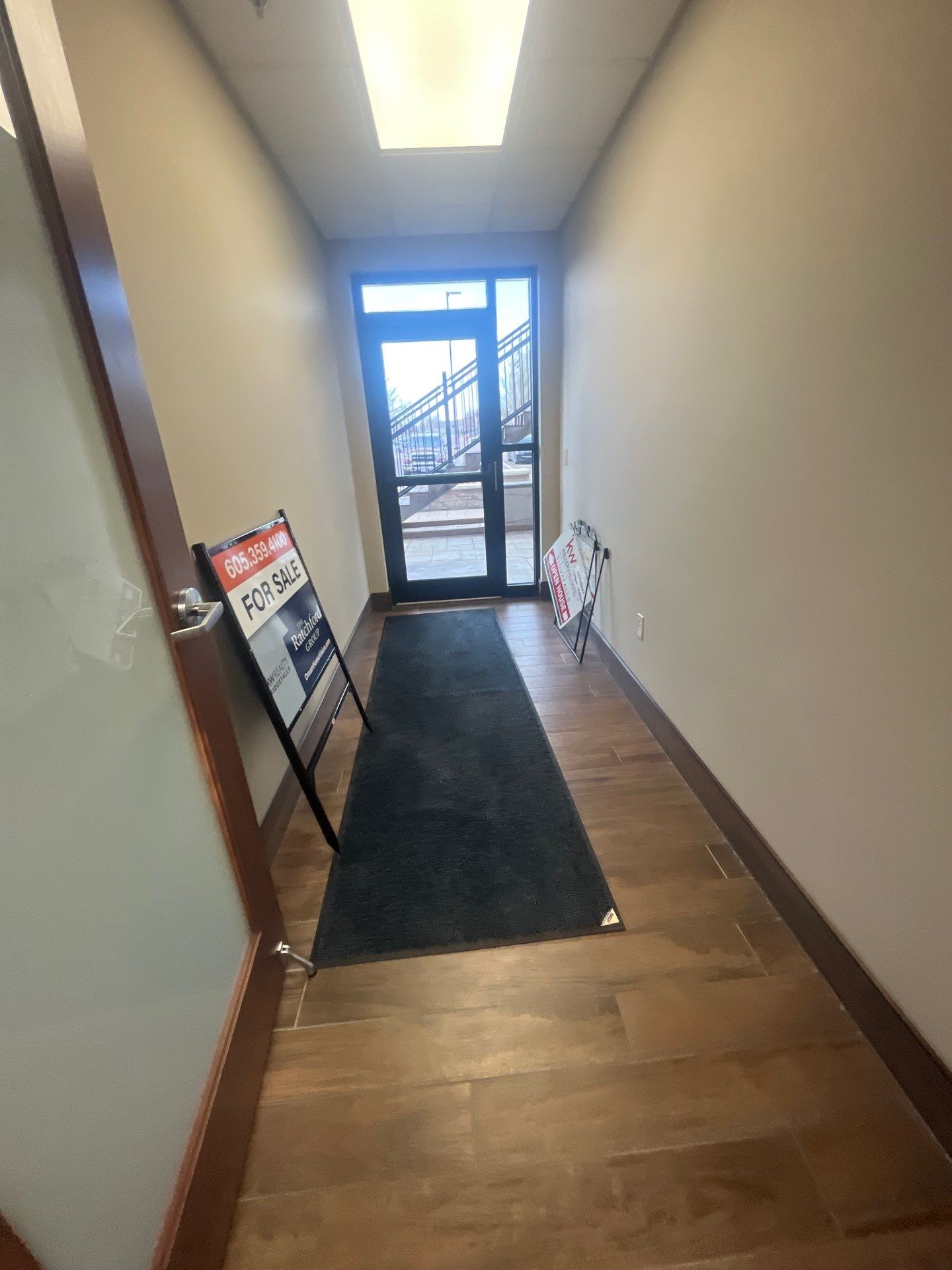 Commercial Office Interior Remodel and Modern Suite Refresh in Sioux Falls by Select Painting, Coatings & Garage Cabinets