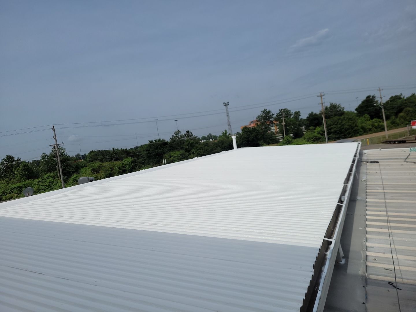 Commercial Metal Restoration System using Aldocoat Coatings by Hostetler Roofing