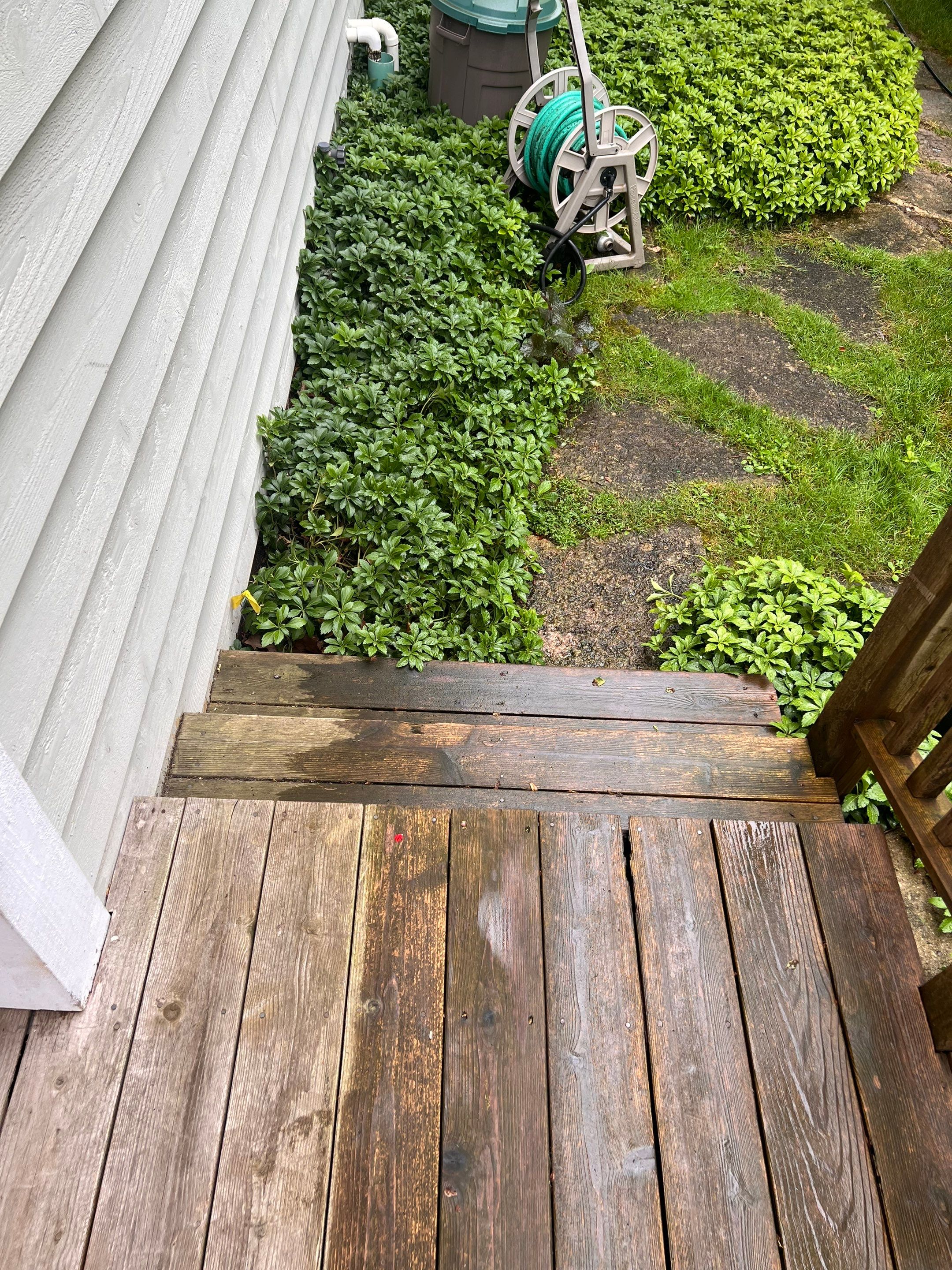 Wood deck cleaning, board replacement and staining by Northern Power Washing LLC.