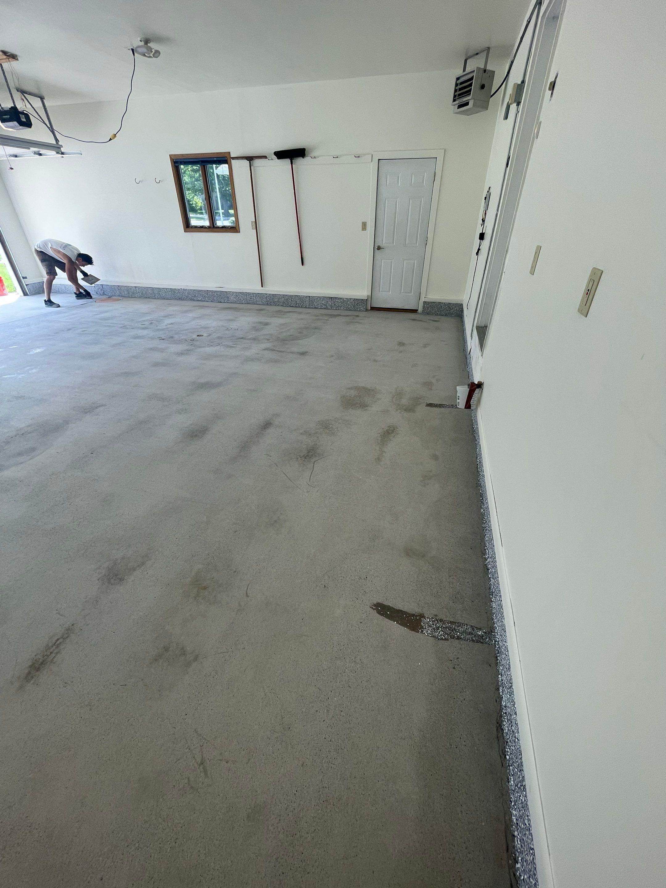 Madison Garage Concrete Coating with Feather Grey Speckle Finish by Select Painting, Coatings & Garage Cabinets