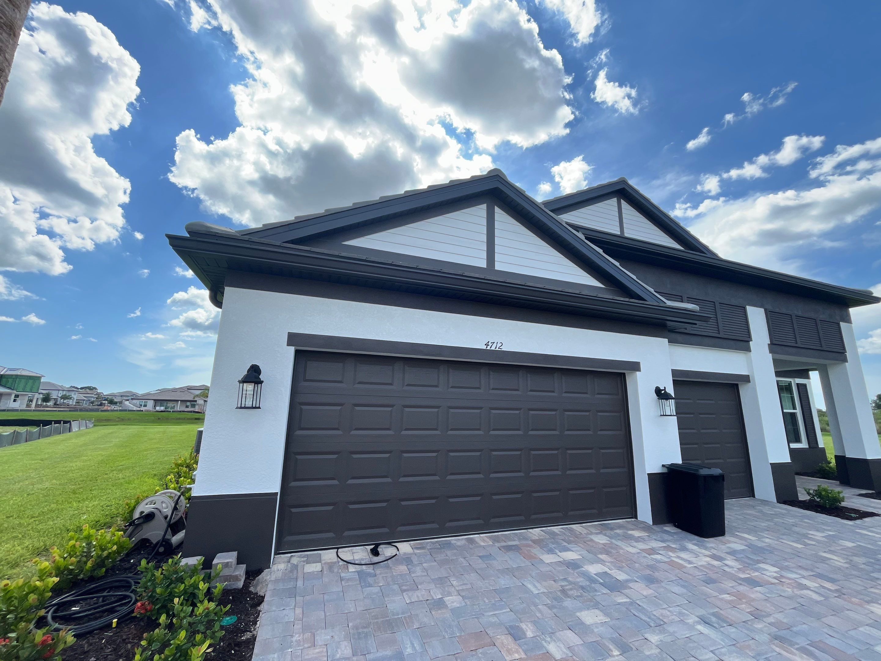 Modern Black Bronze Seamless Gutters for a Stylish Home by Gutter Professors