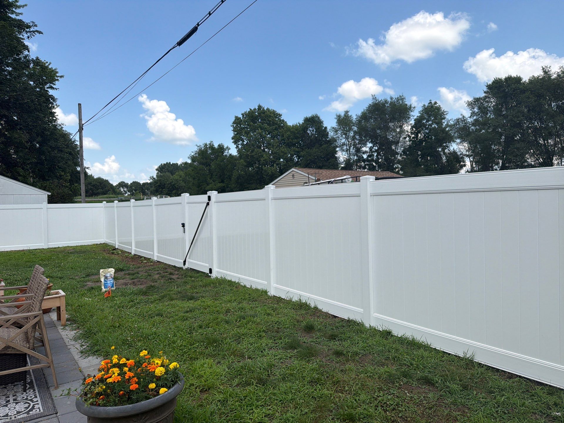 White Vinyl Privacy Fence Installation in Waterloo, Iowa by Perfect Picket Fence and Stain