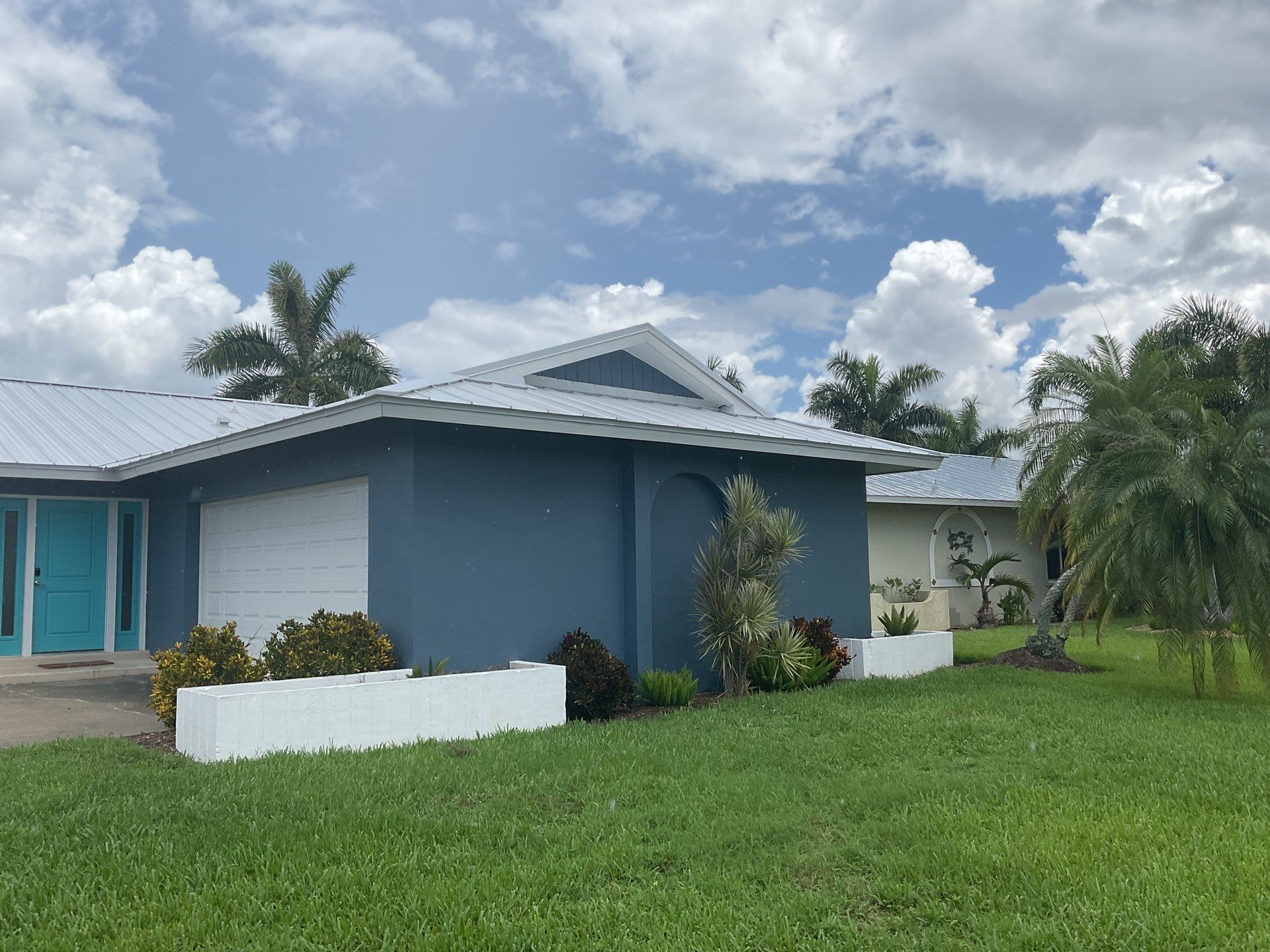 White Downspouts and Gutters Combo in Punta Gorda FL by Gutter Professors