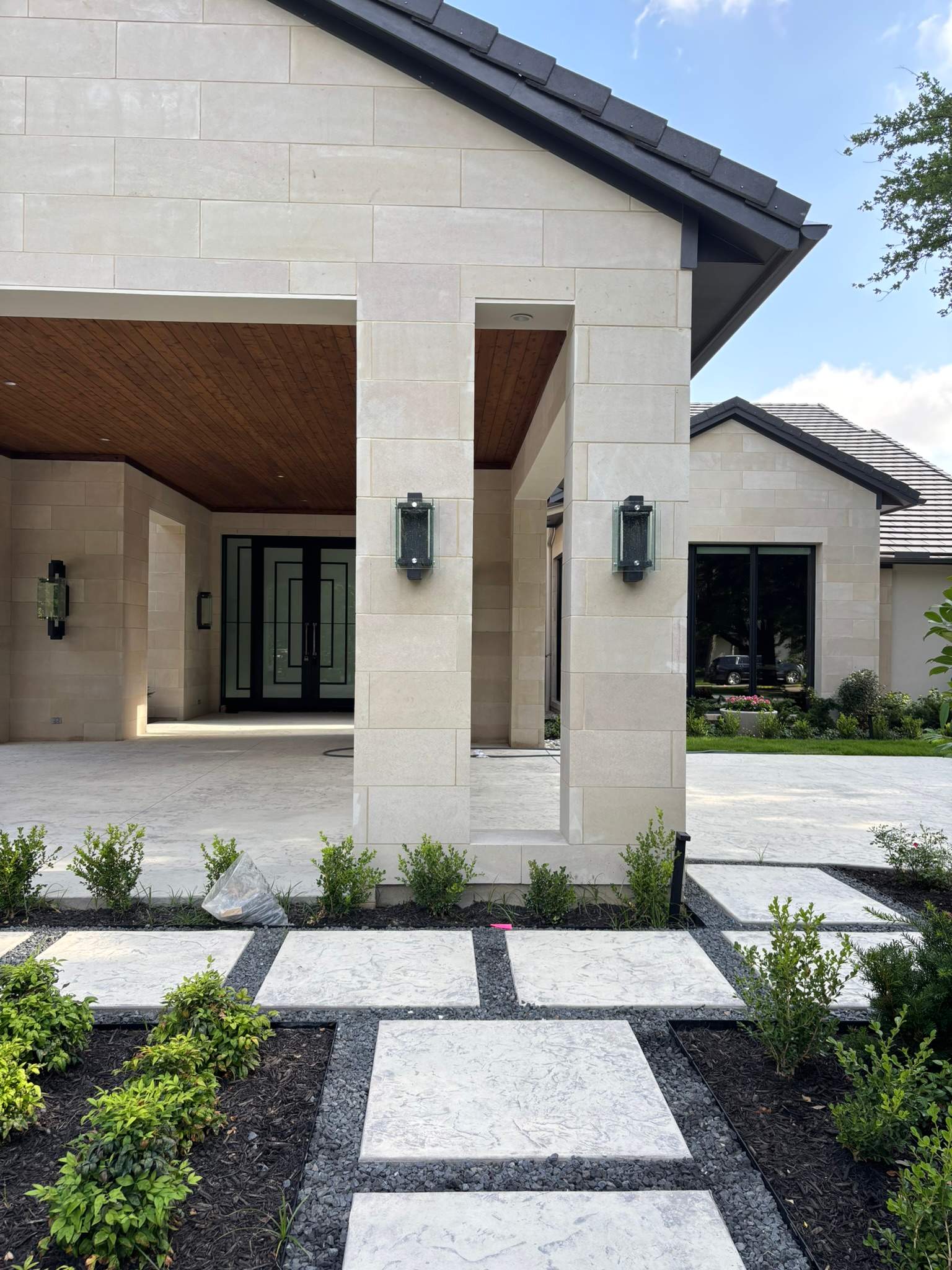 Modern Metal and Glass Entryway Installation with Custom Hardware Finishing in Dallas by Solara Custom Living