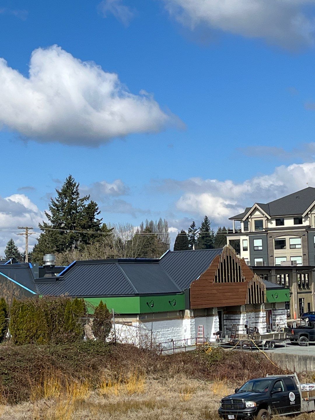 Commercial Roofing Installation using 12" Prolok metal and hidden gutters! by Top Notch Roofing Inc